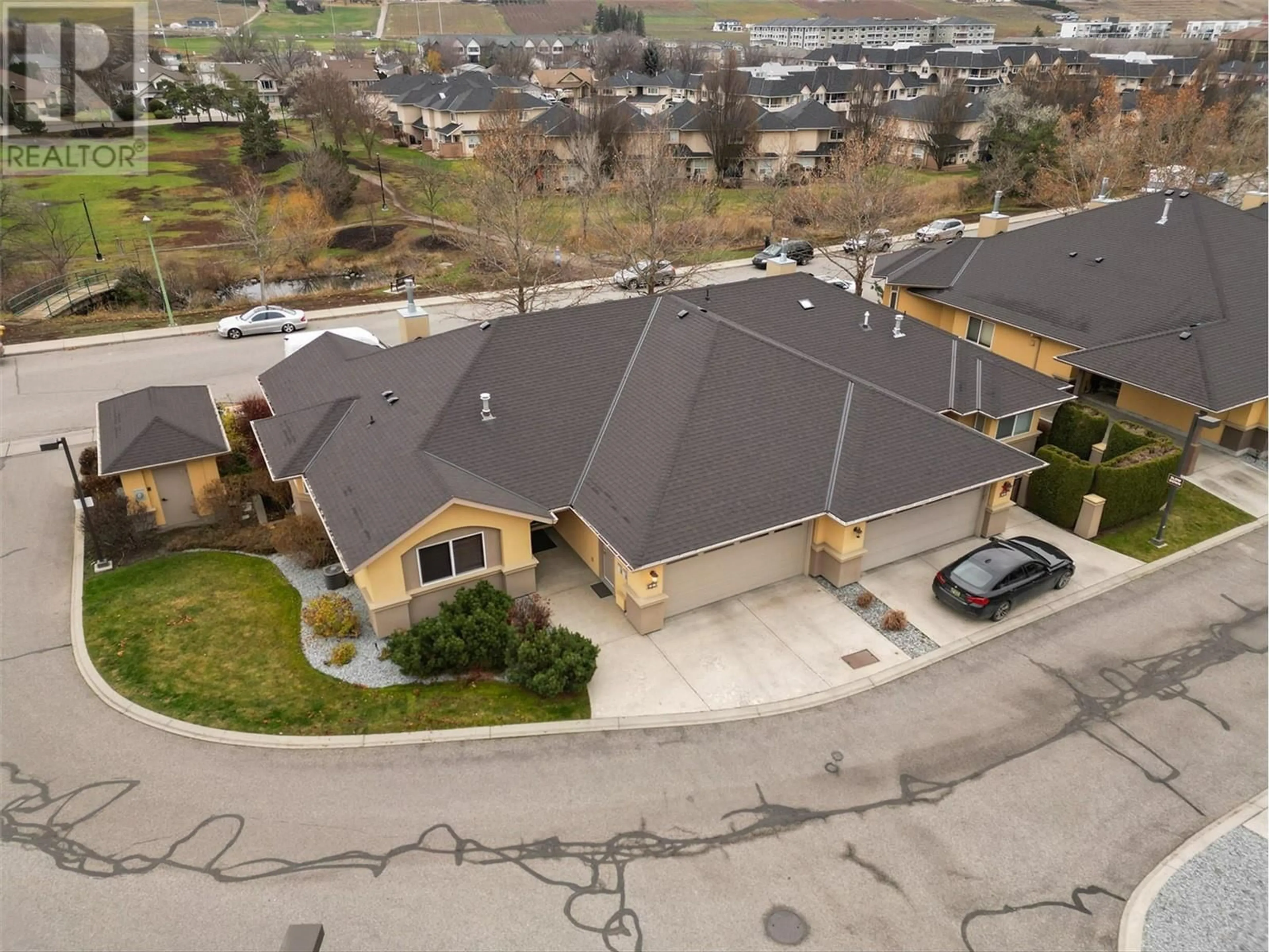 A pic from outside/outdoor area/front of a property/back of a property/a pic from drone, unknown for 218 Glen Park Drive Unit# 1, Kelowna British Columbia V1V2W3