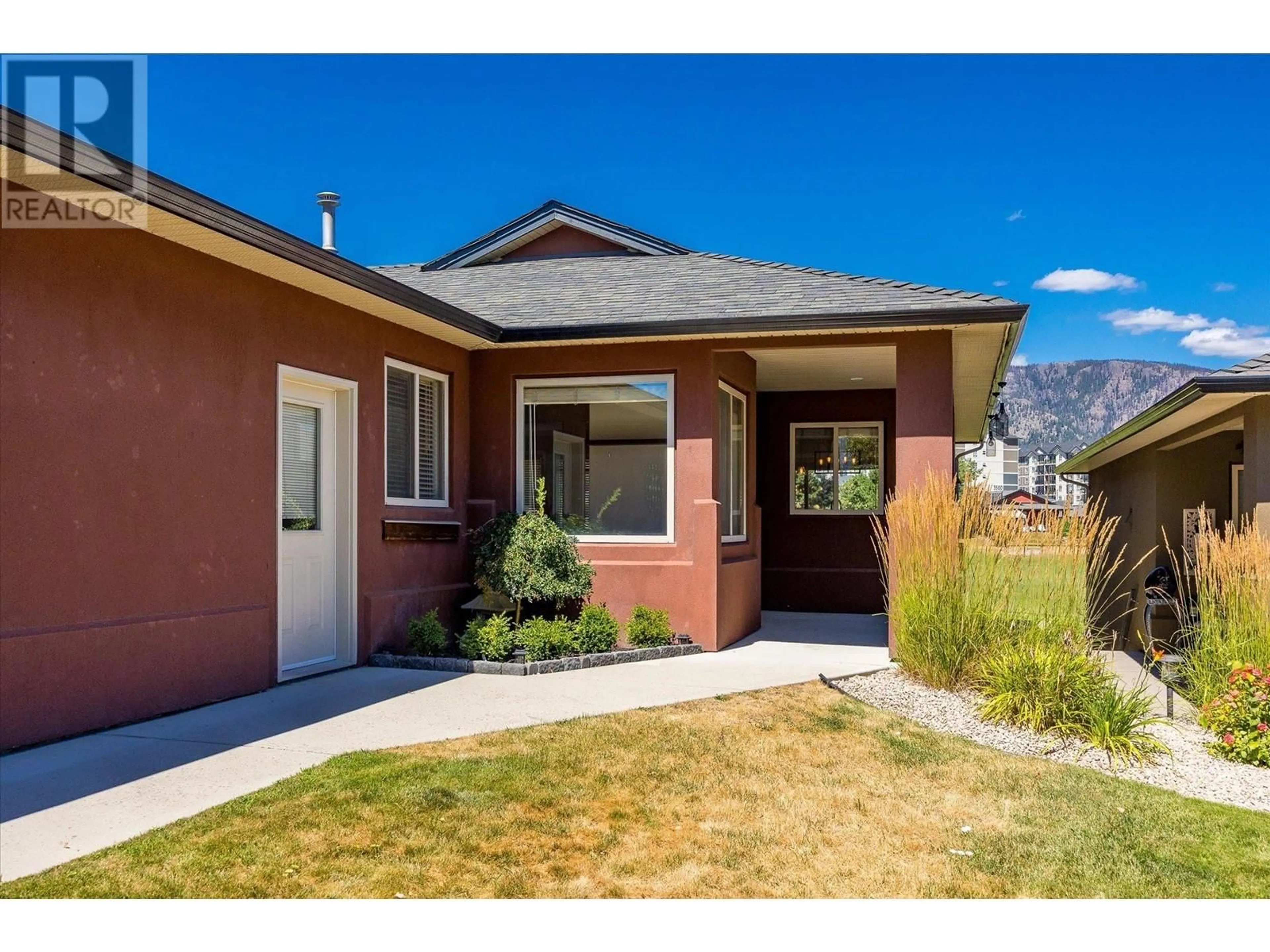 Home with vinyl exterior material, street for 2302 PINE VISTA PLACE, West Kelowna British Columbia V4T2Y1