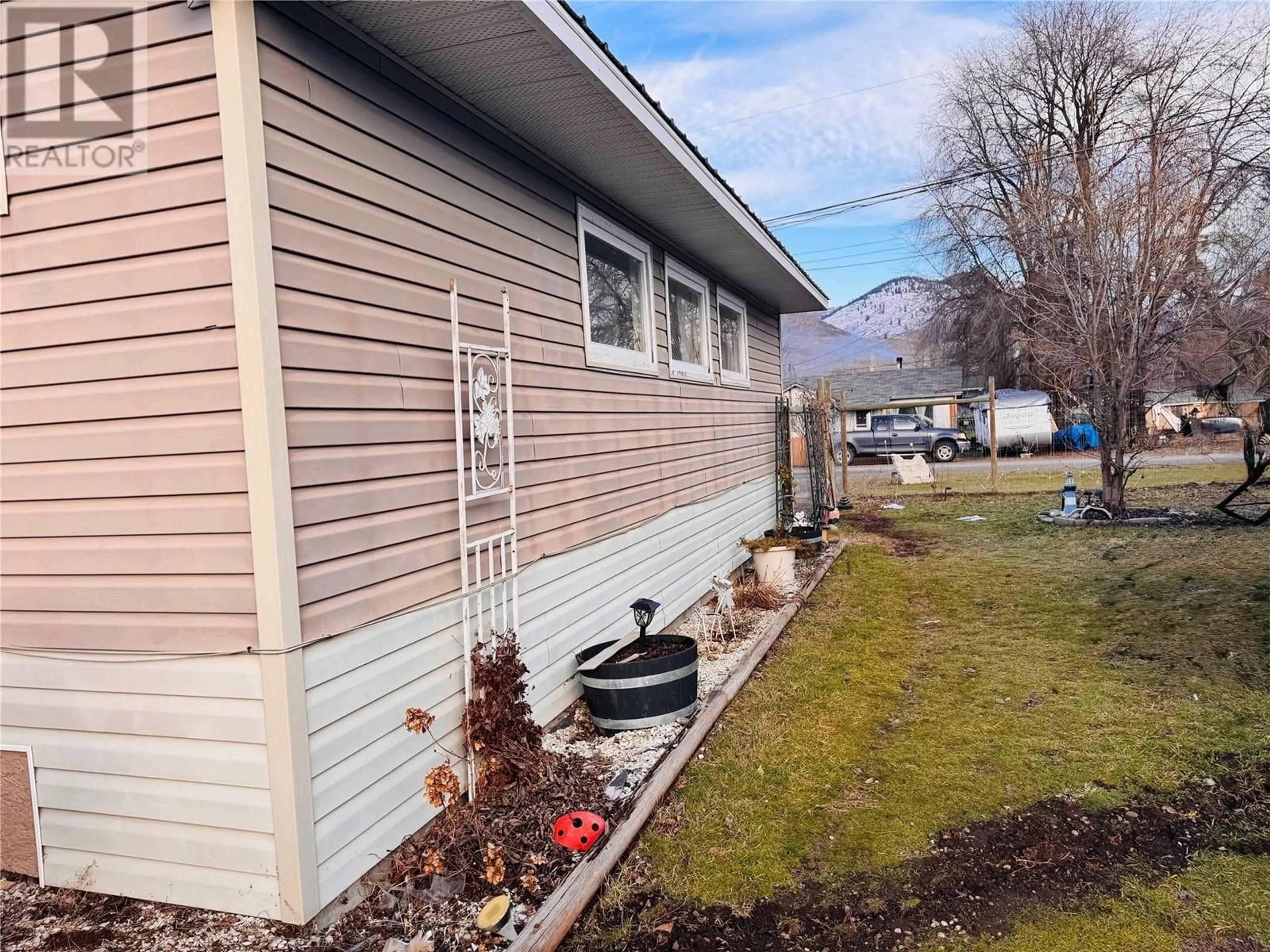 A pic from outside/outdoor area/front of a property/back of a property/a pic from drone, unknown for 6465 7TH Street, Grand Forks British Columbia V0H1H0