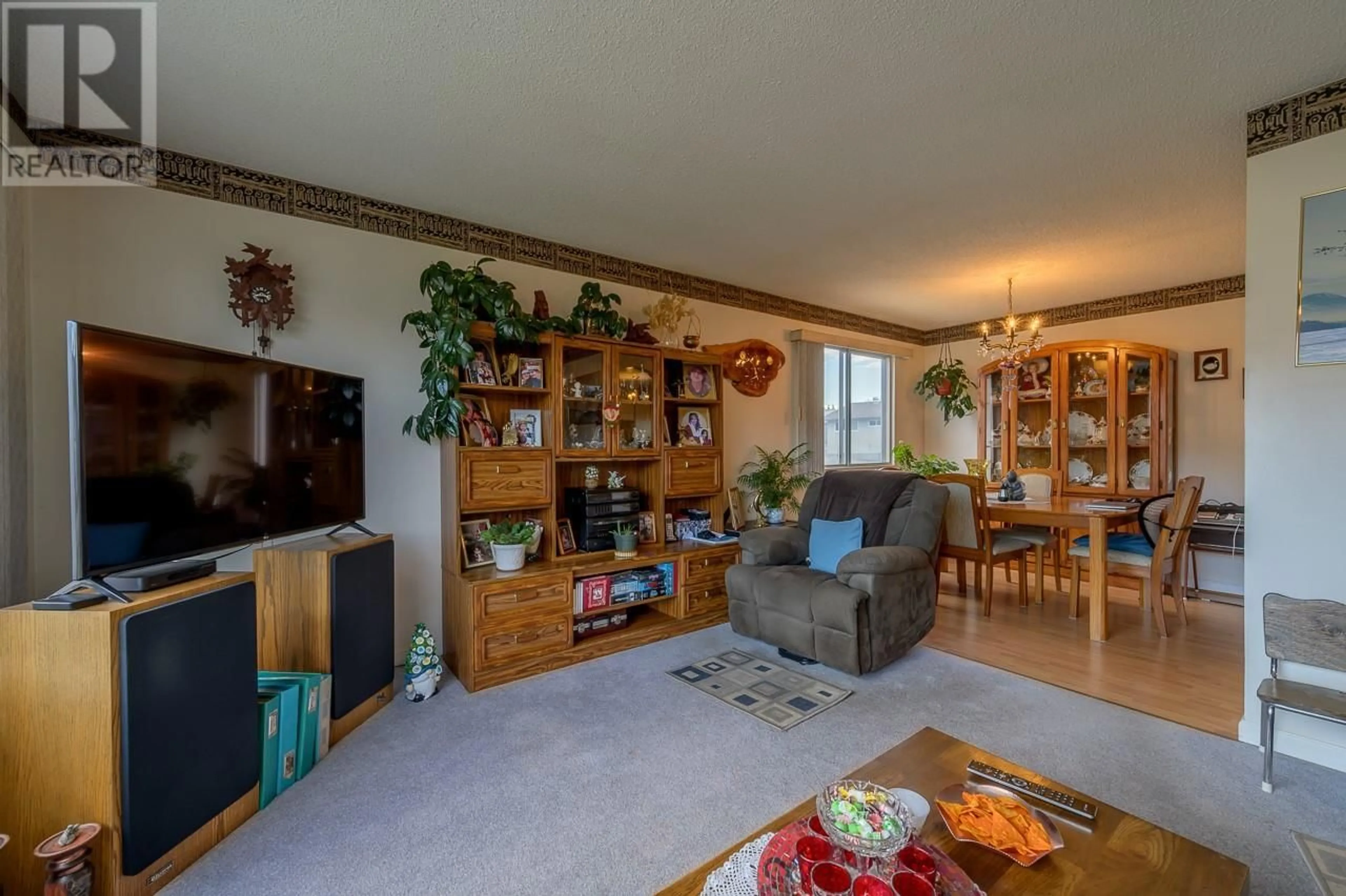 Living room with furniture, wood/laminate floor for 1775 Parkcrest Avenue, Kamloops British Columbia V2B4W8