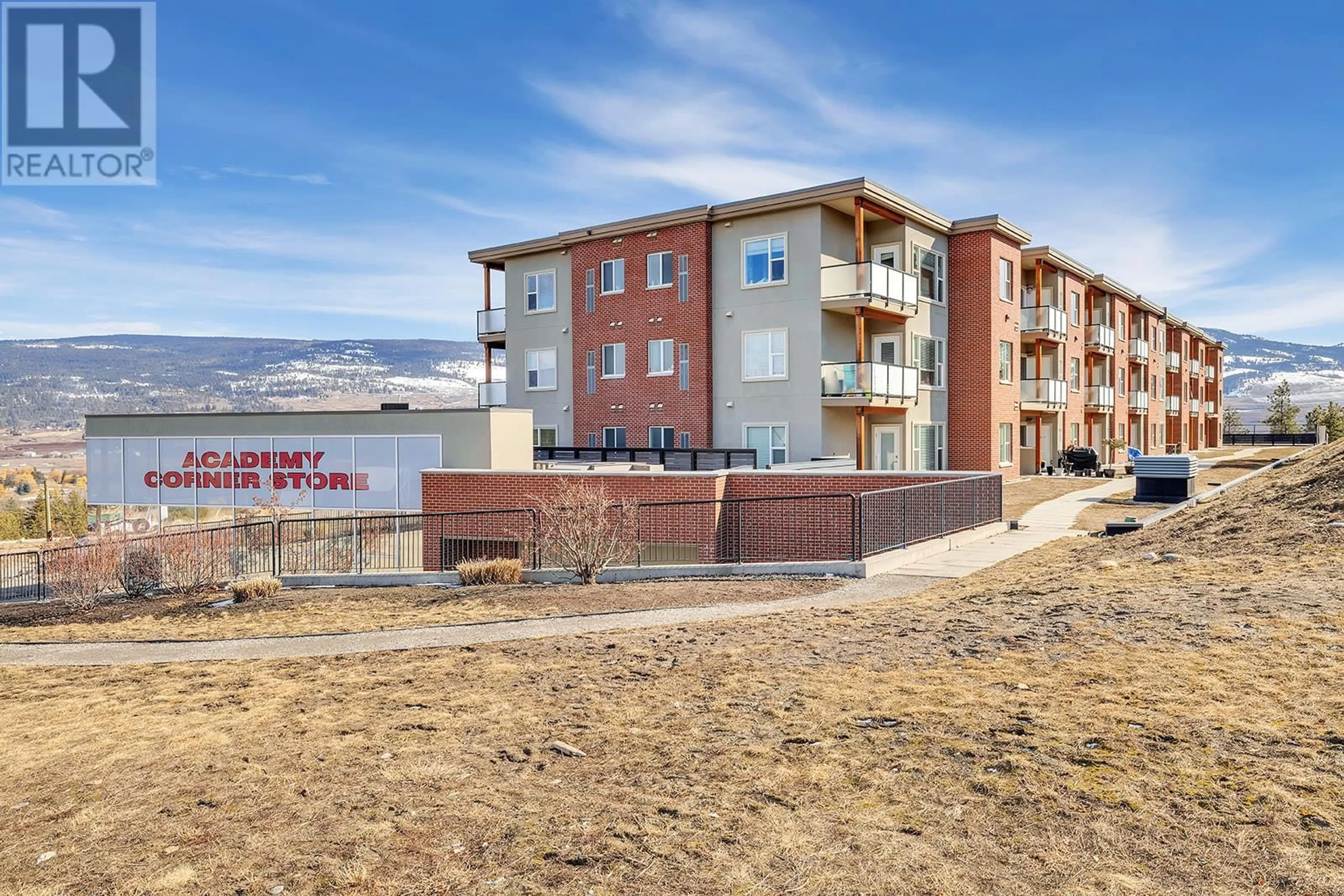 A pic from outside/outdoor area/front of a property/back of a property/a pic from drone, water/lake/river/ocean view for 975 Academy Way Unit# 214, Kelowna British Columbia V1V3C8