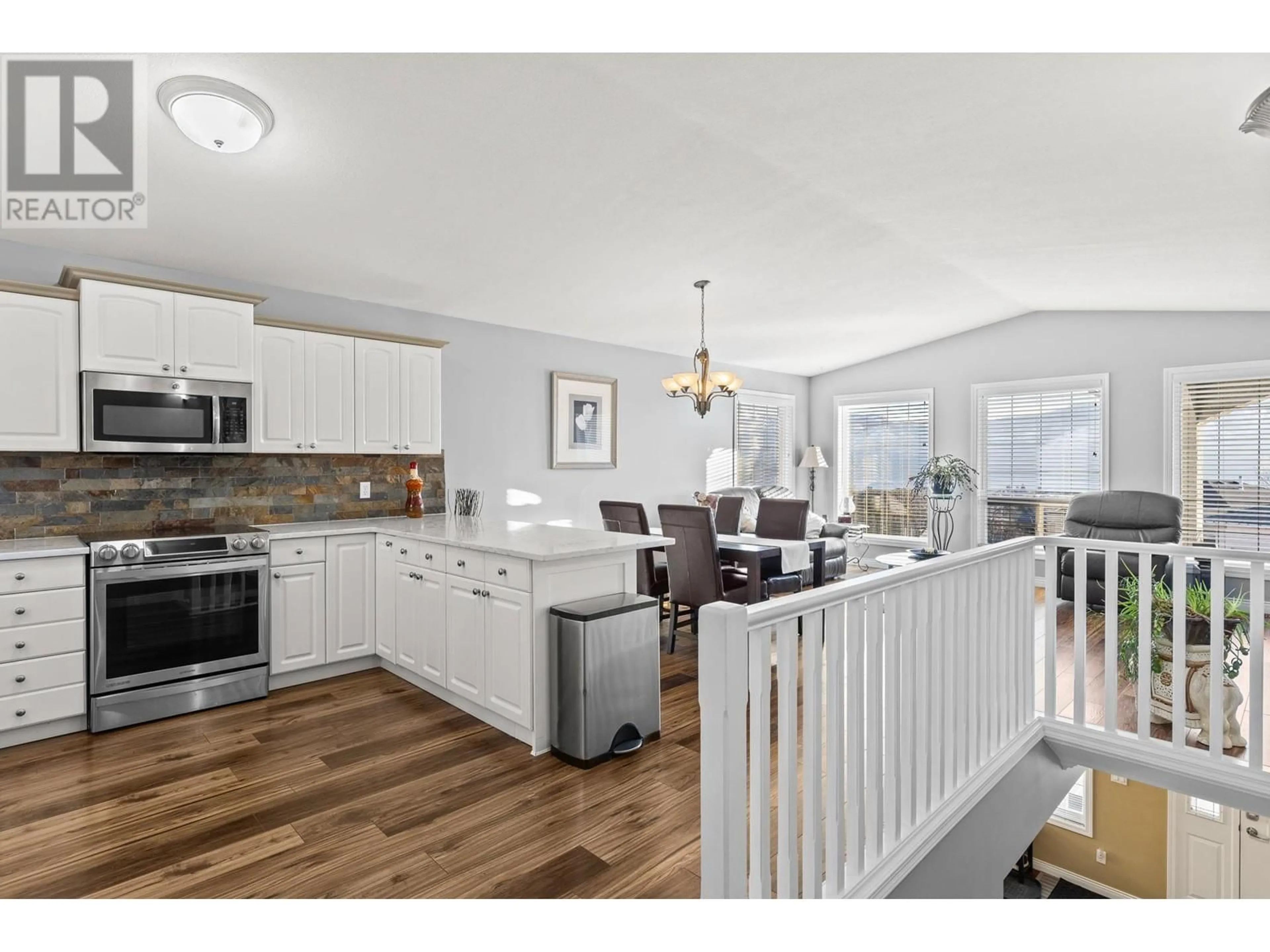 Open concept kitchen, wood/laminate floor for 417 - 2440 OLD OKANAGAN HIGHWAY, Westbank British Columbia V4T1X6