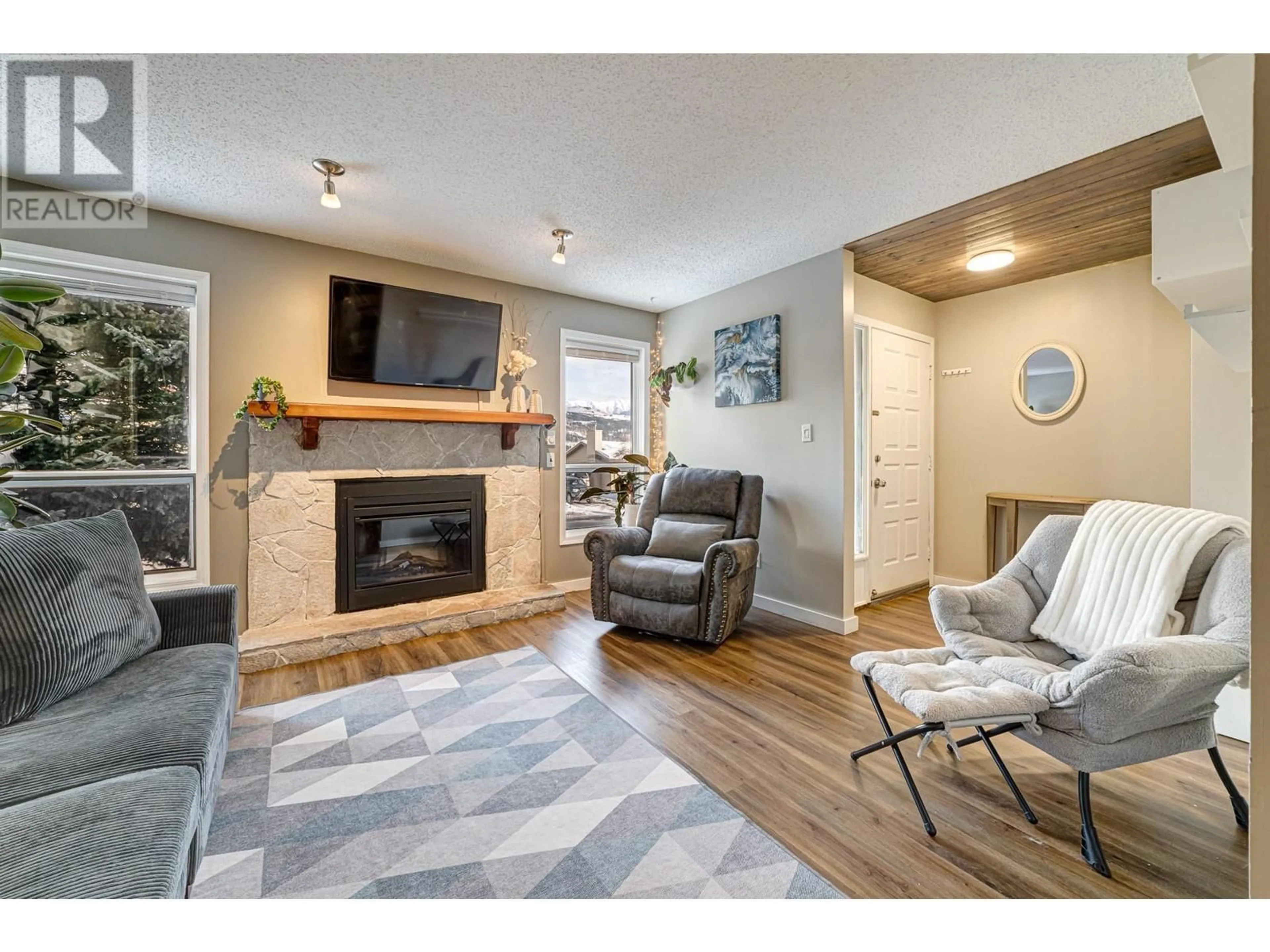 Living room with furniture, wood/laminate floor for 1219 Pinyon Road, Sparwood British Columbia V0B2G2