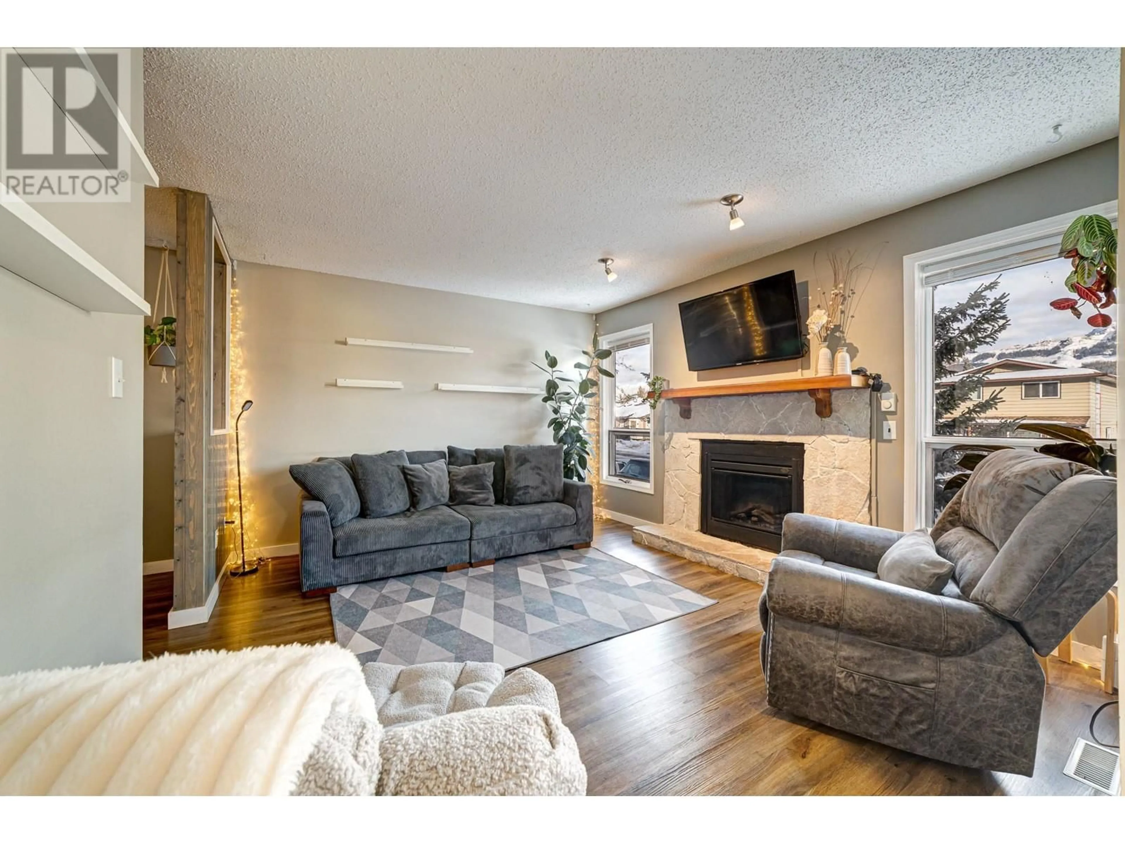 Living room with furniture, wood/laminate floor for 1219 Pinyon Road, Sparwood British Columbia V0B2G2