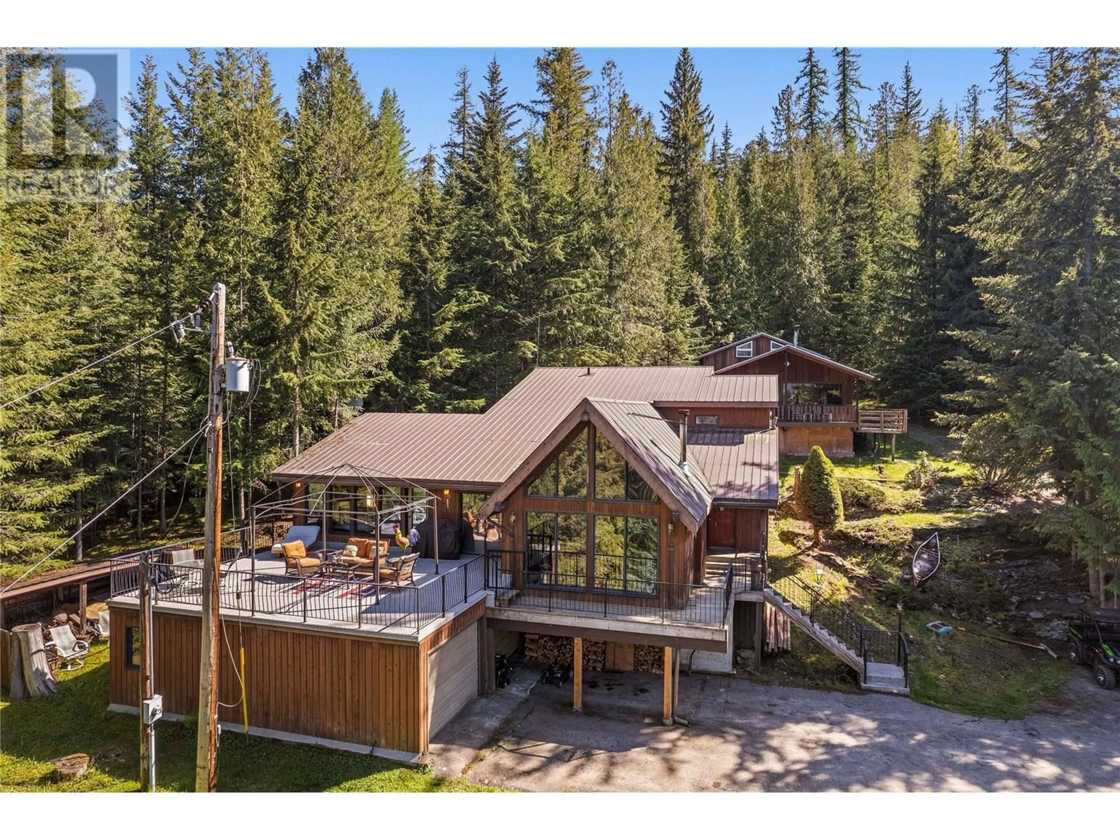 A pic from outside/outdoor area/front of a property/back of a property/a pic from drone, forest/trees view for 5508 Eagle Bay Road, Eagle Bay British Columbia V0E1T0