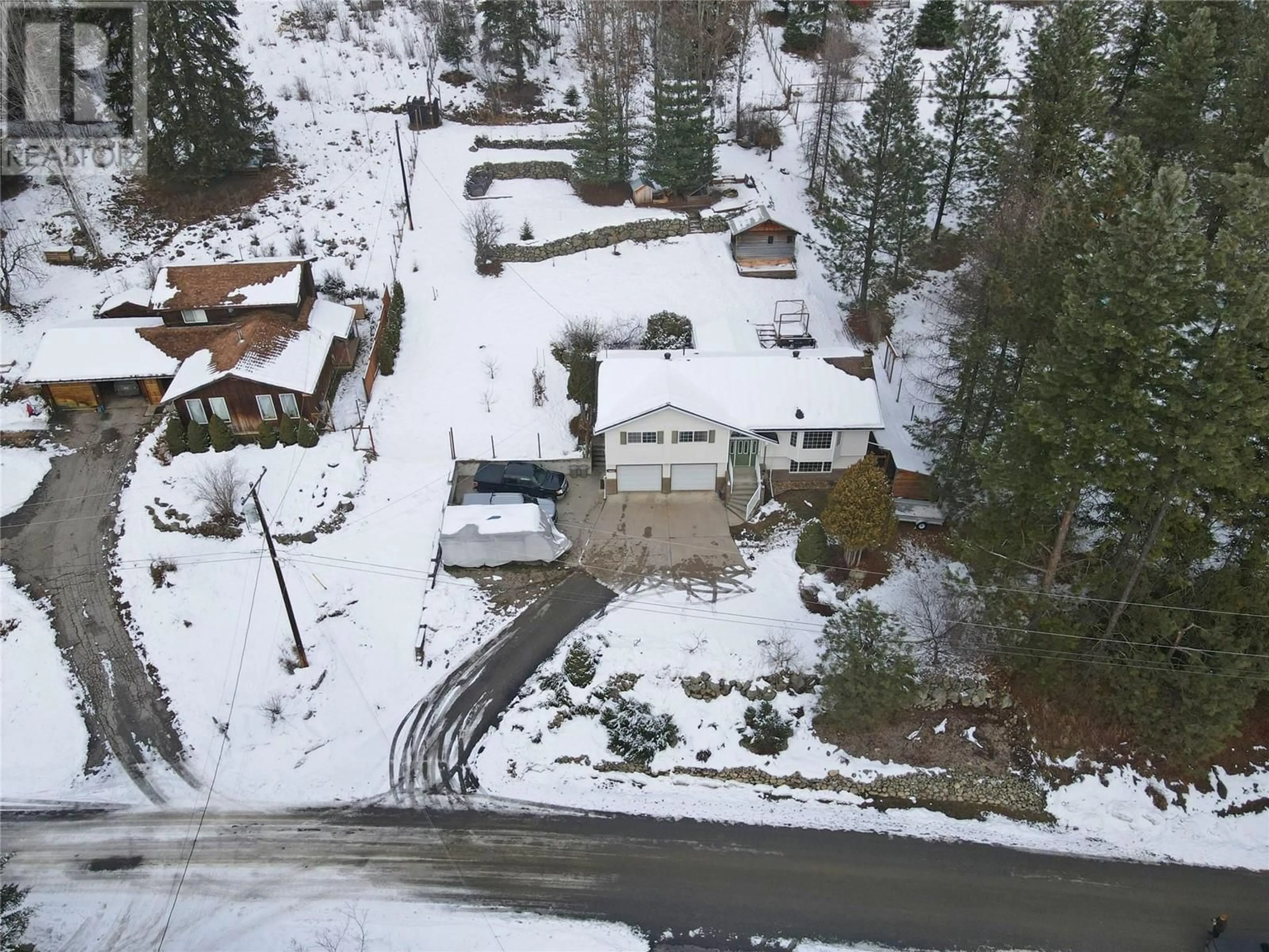 A pic from outside/outdoor area/front of a property/back of a property/a pic from drone, street for 3831 WOODCREST Road, Bonnington British Columbia V0G2G3