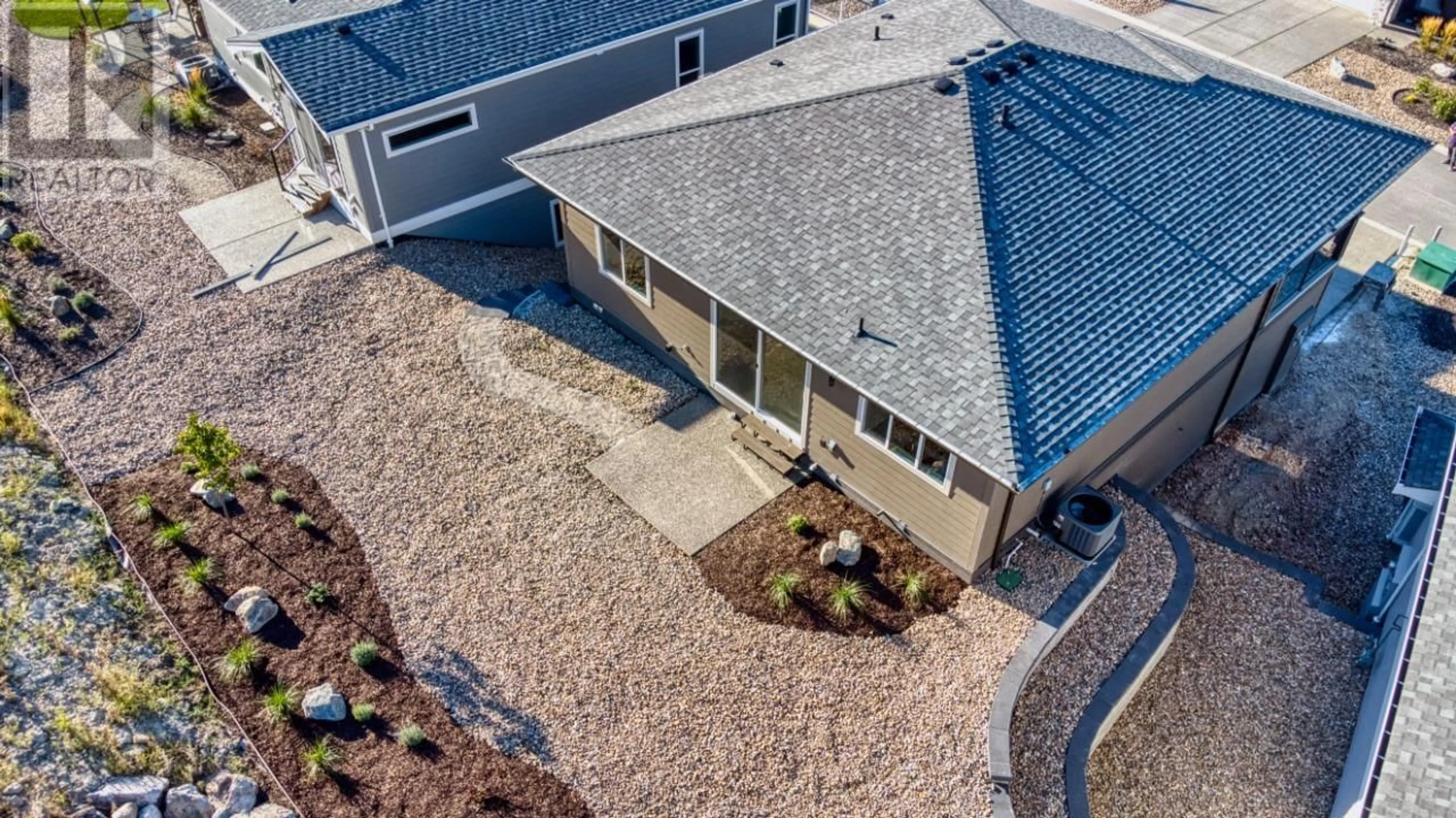 A pic from outside/outdoor area/front of a property/back of a property/a pic from drone, street for 7760 Okanagan Landing Road Unit# 130, Vernon British Columbia V1H1Z4