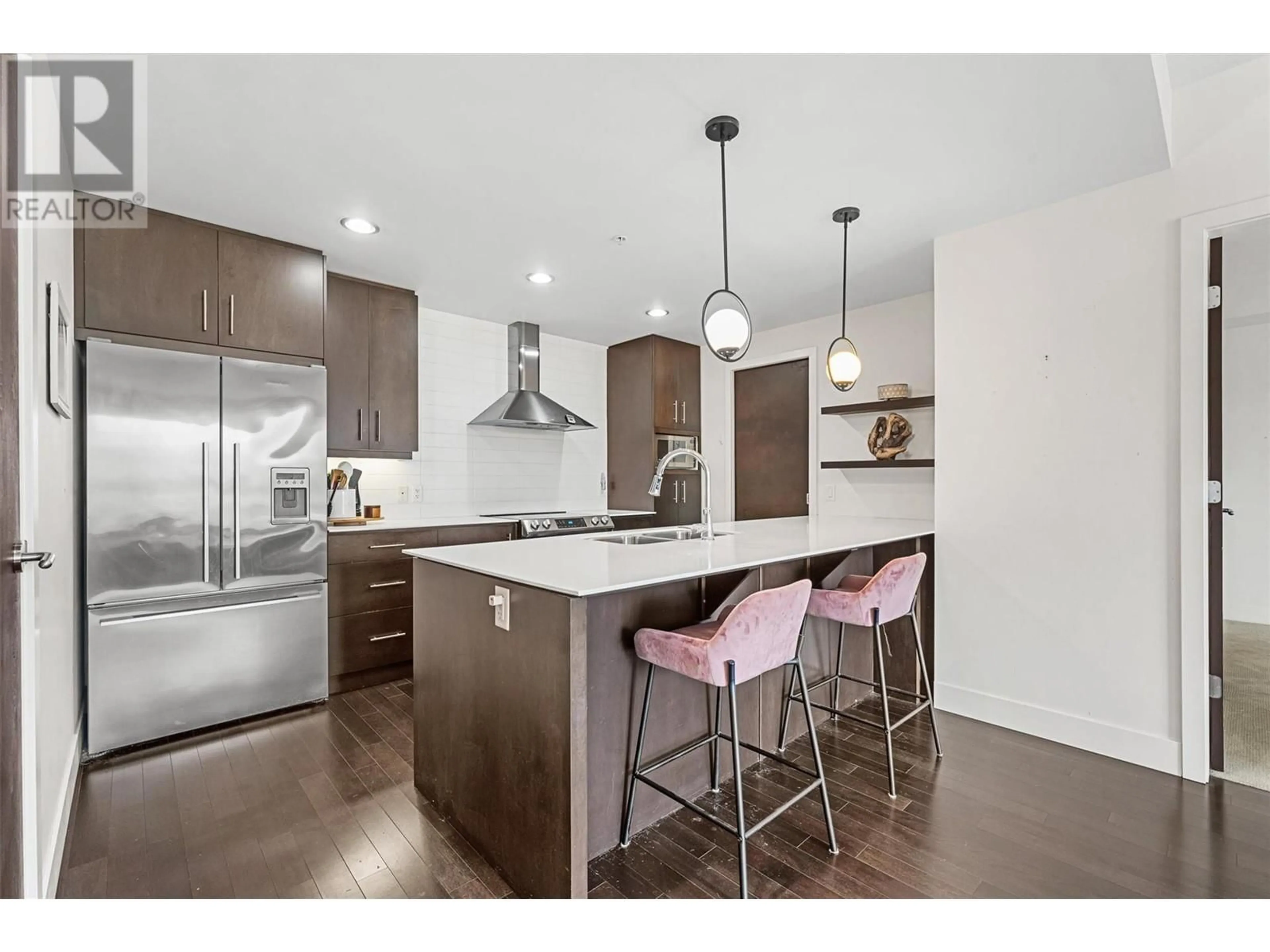 Open concept kitchen, wood/laminate floor for 2040 Springfield Road Unit# 907, Kelowna British Columbia V1Y9N7