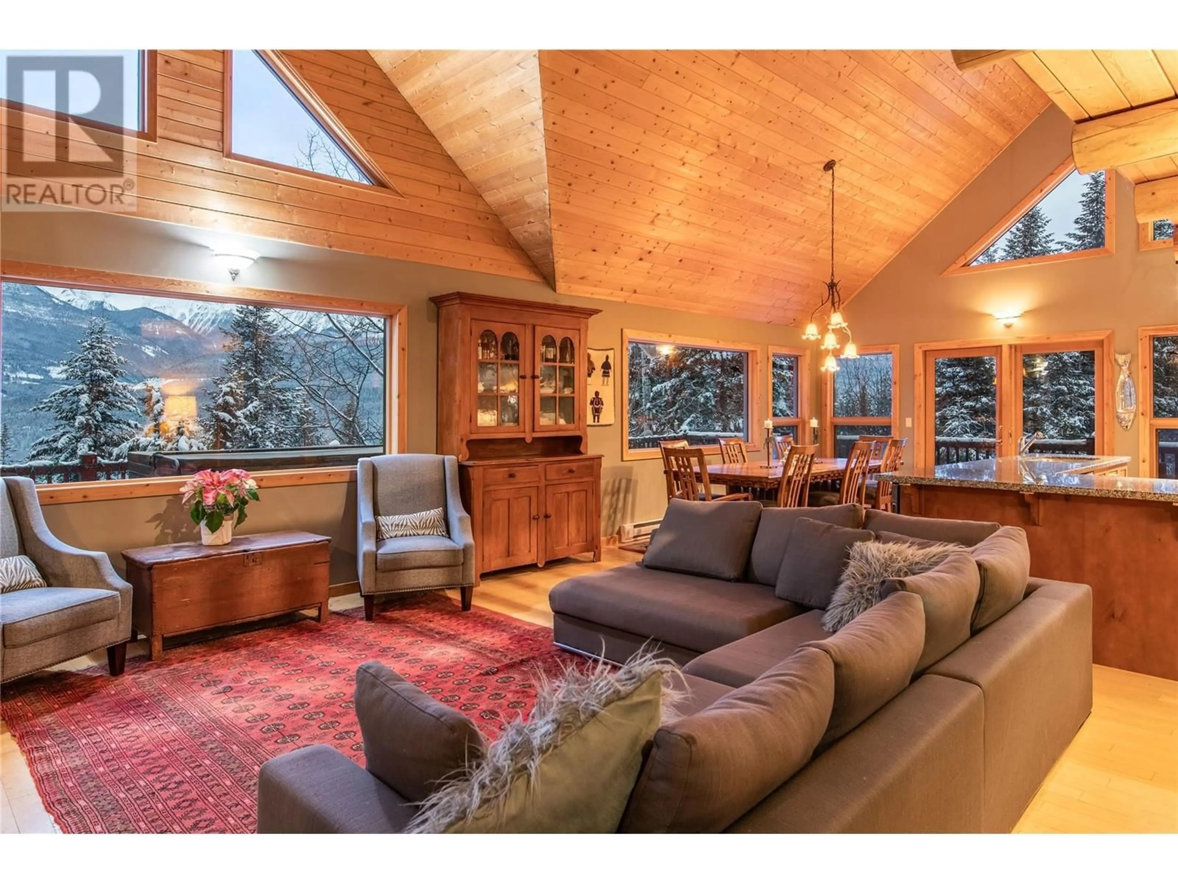 Living room with furniture, wood/laminate floor for 716 Almberg Road, Golden British Columbia V0A1H2