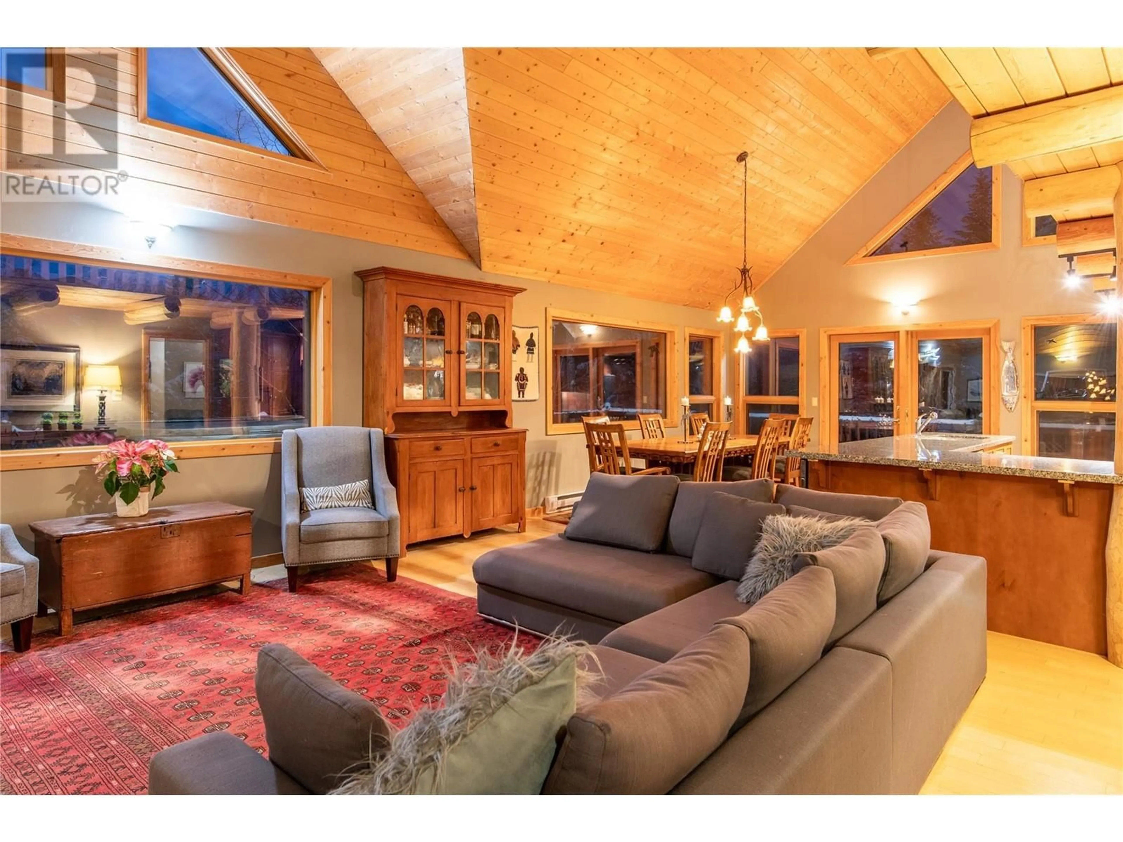 Living room with furniture, wood/laminate floor for 716 Almberg Road, Golden British Columbia V0A1H2