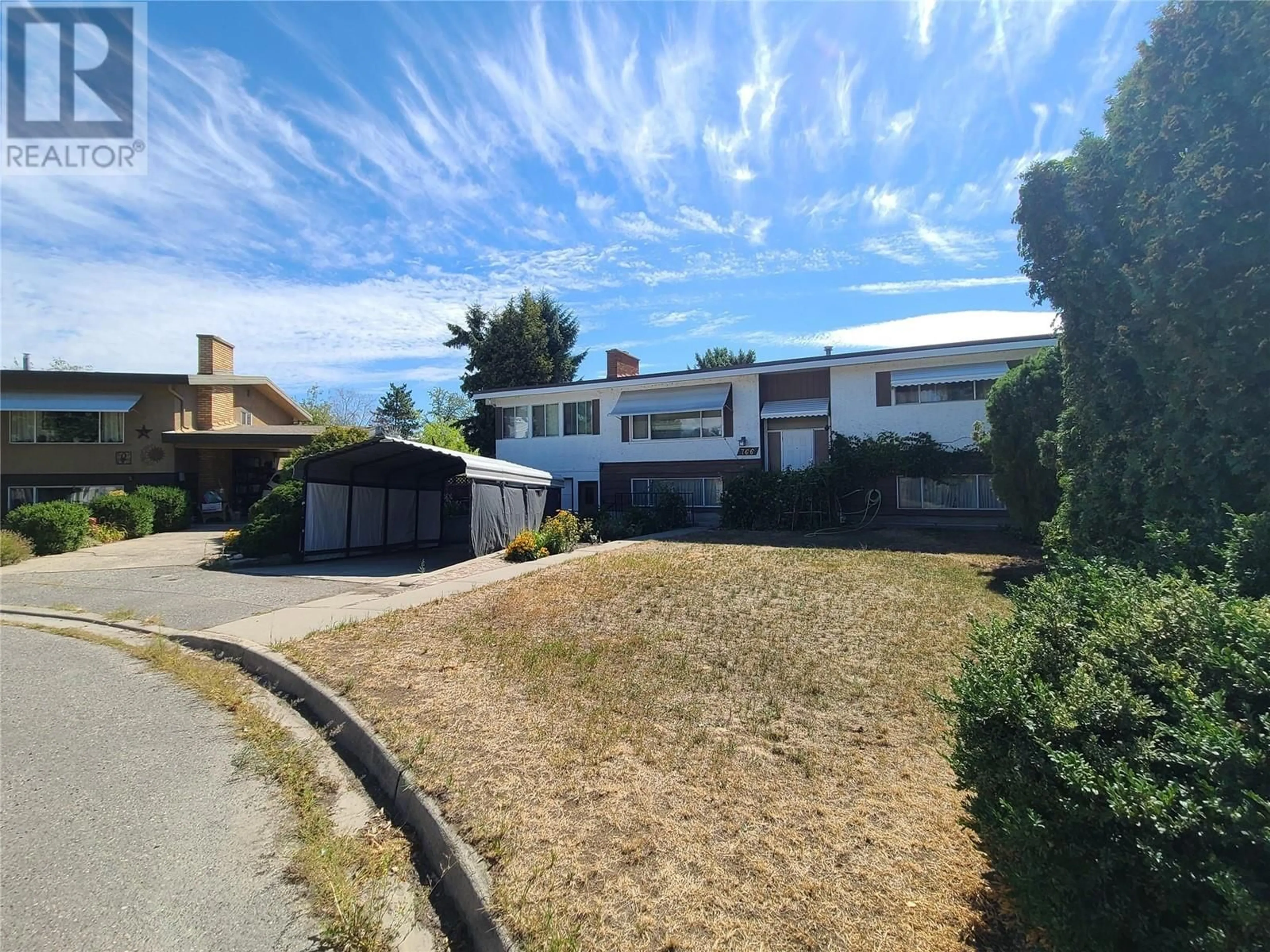 A pic from outside/outdoor area/front of a property/back of a property/a pic from drone, street for 766 COOPLAND CRESCENT, Kelowna British Columbia V1Y2V1