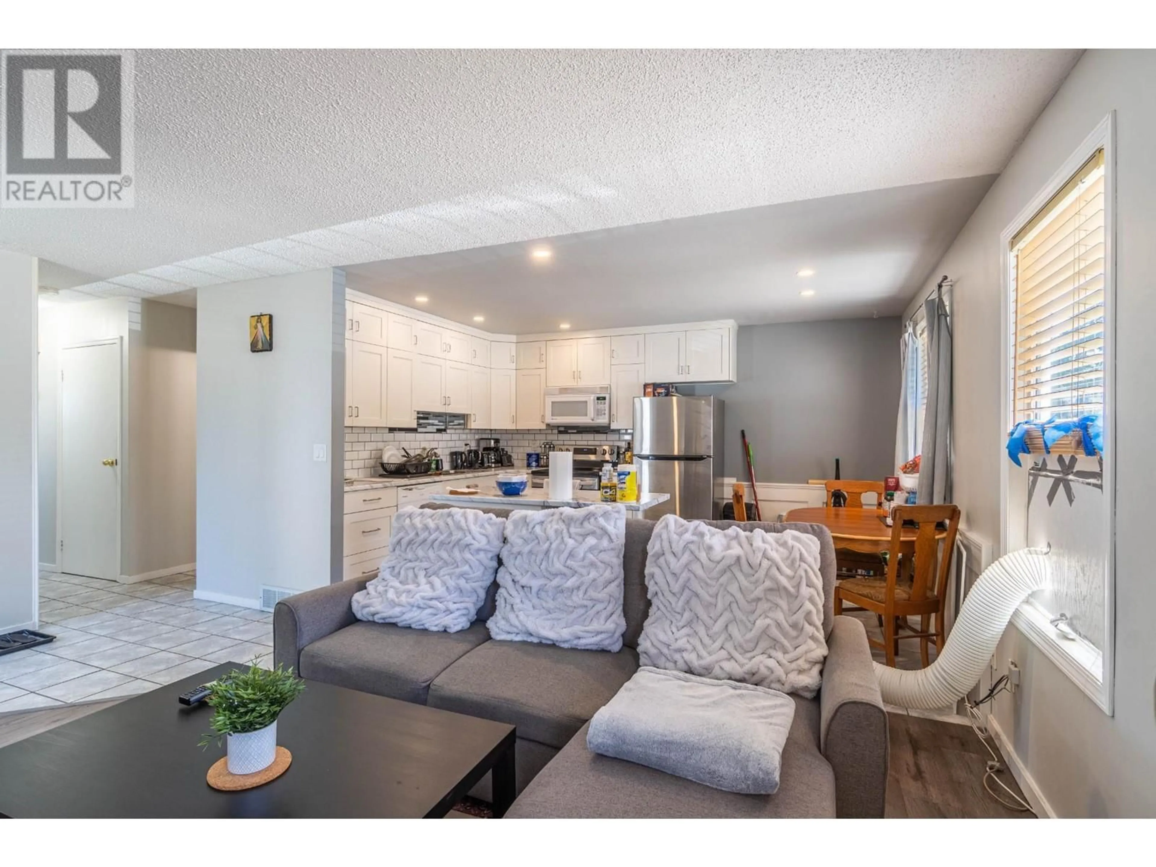 Open concept kitchen, wood/laminate floor for 416 WADDINGTON Drive, Kamloops British Columbia V2H1T7