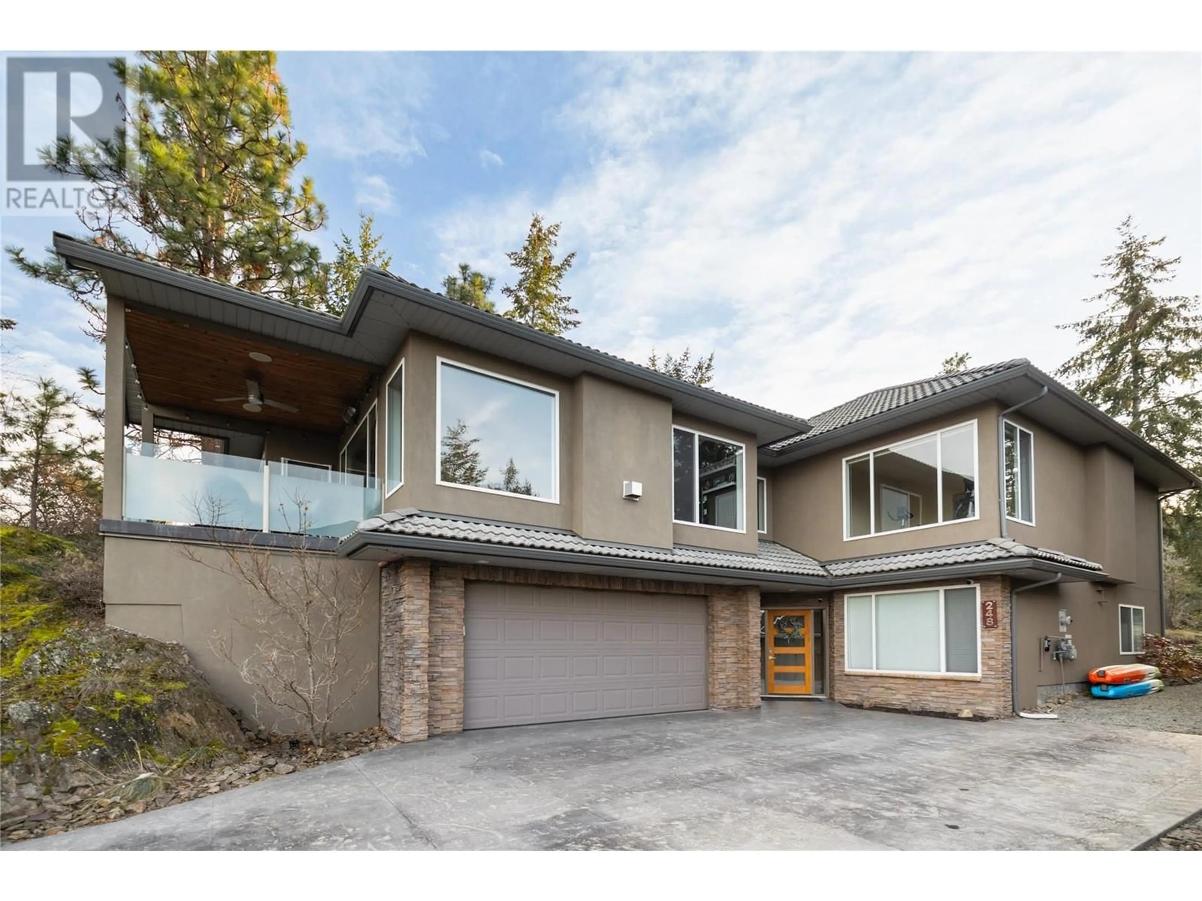 Home with brick exterior material, street for 248 Magic Drive, Kelowna British Columbia V1V1N2