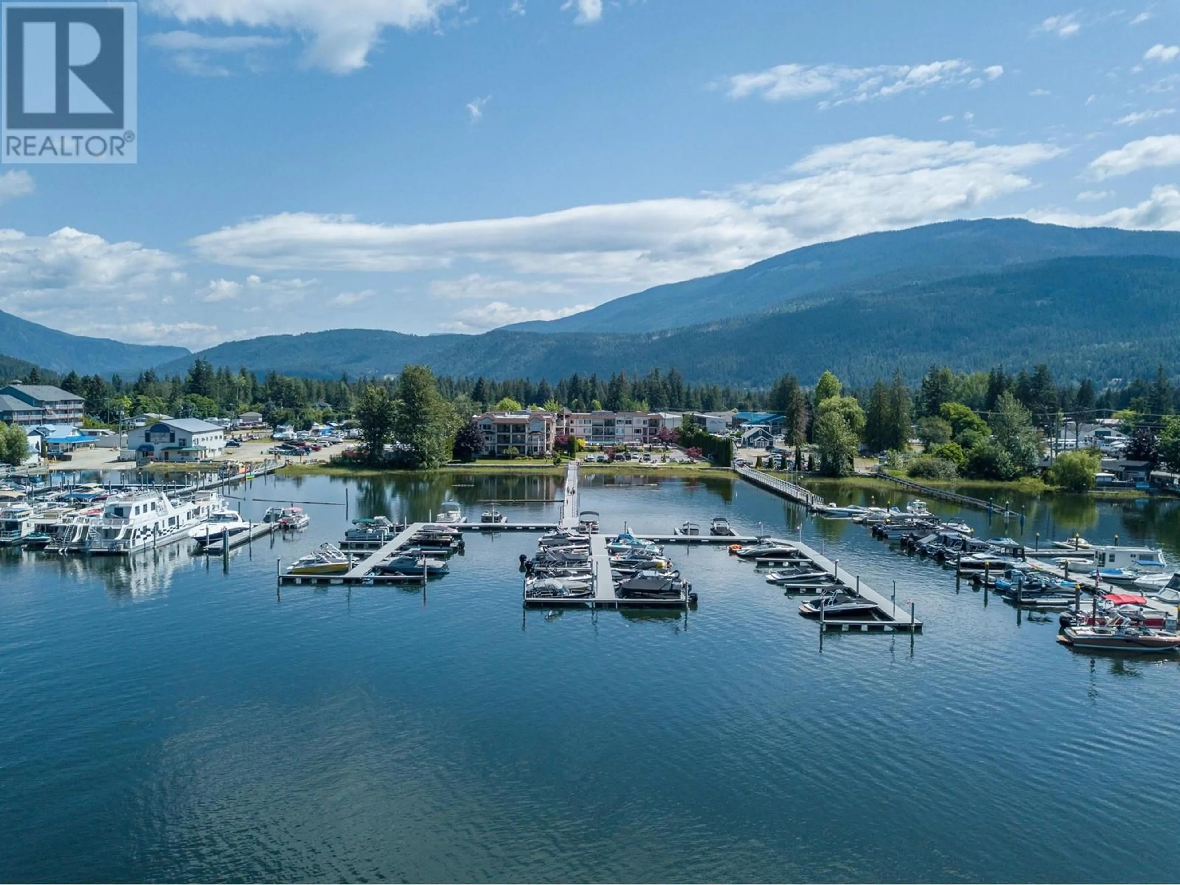 A pic from outside/outdoor area/front of a property/back of a property/a pic from drone, water/lake/river/ocean view for 1002 Riverside Avenue Unit# 308, Sicamous British Columbia V0E2V1