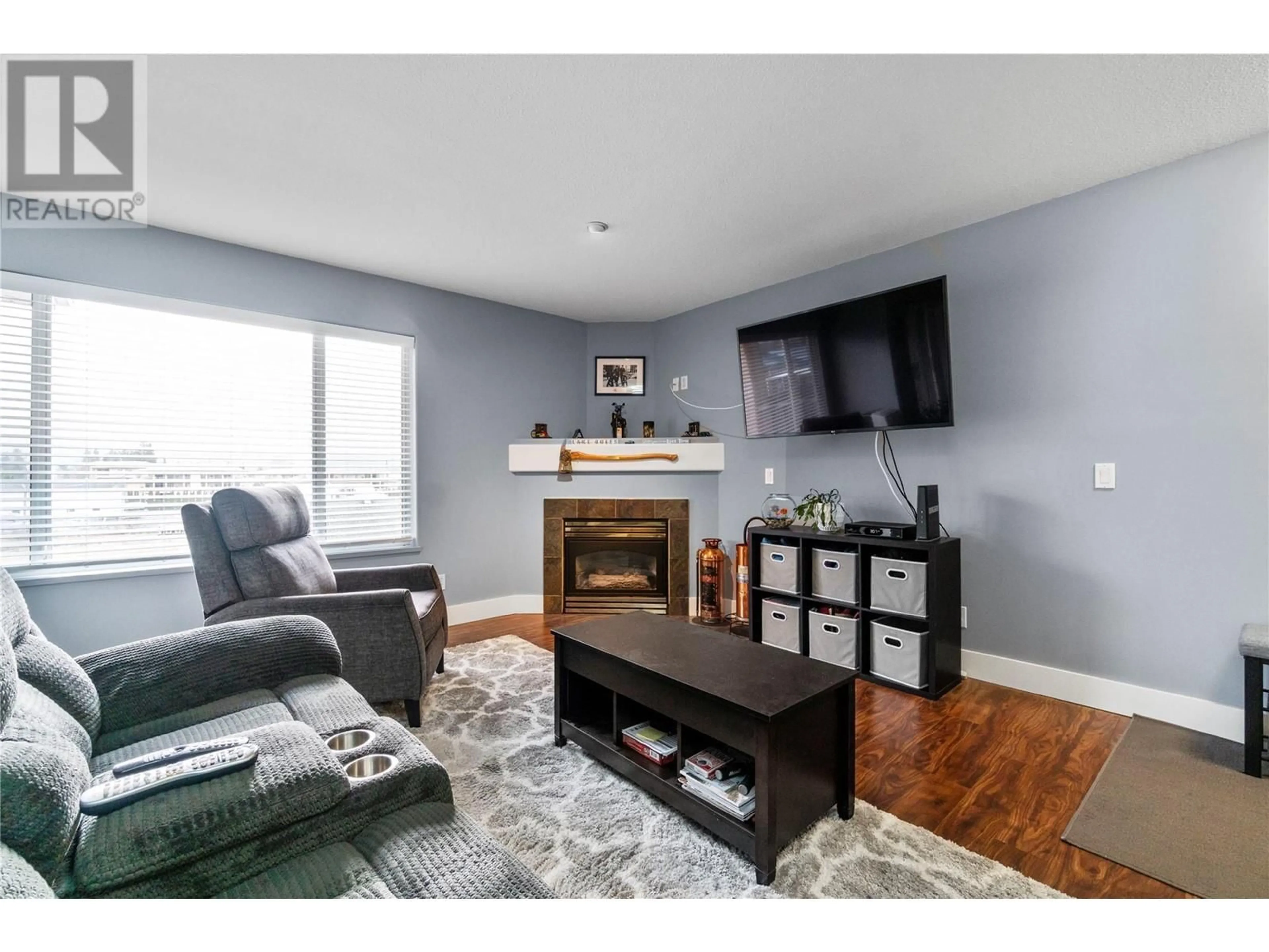 Living room with furniture, wood/laminate floor for 1002 Riverside Avenue Unit# 308, Sicamous British Columbia V0E2V1