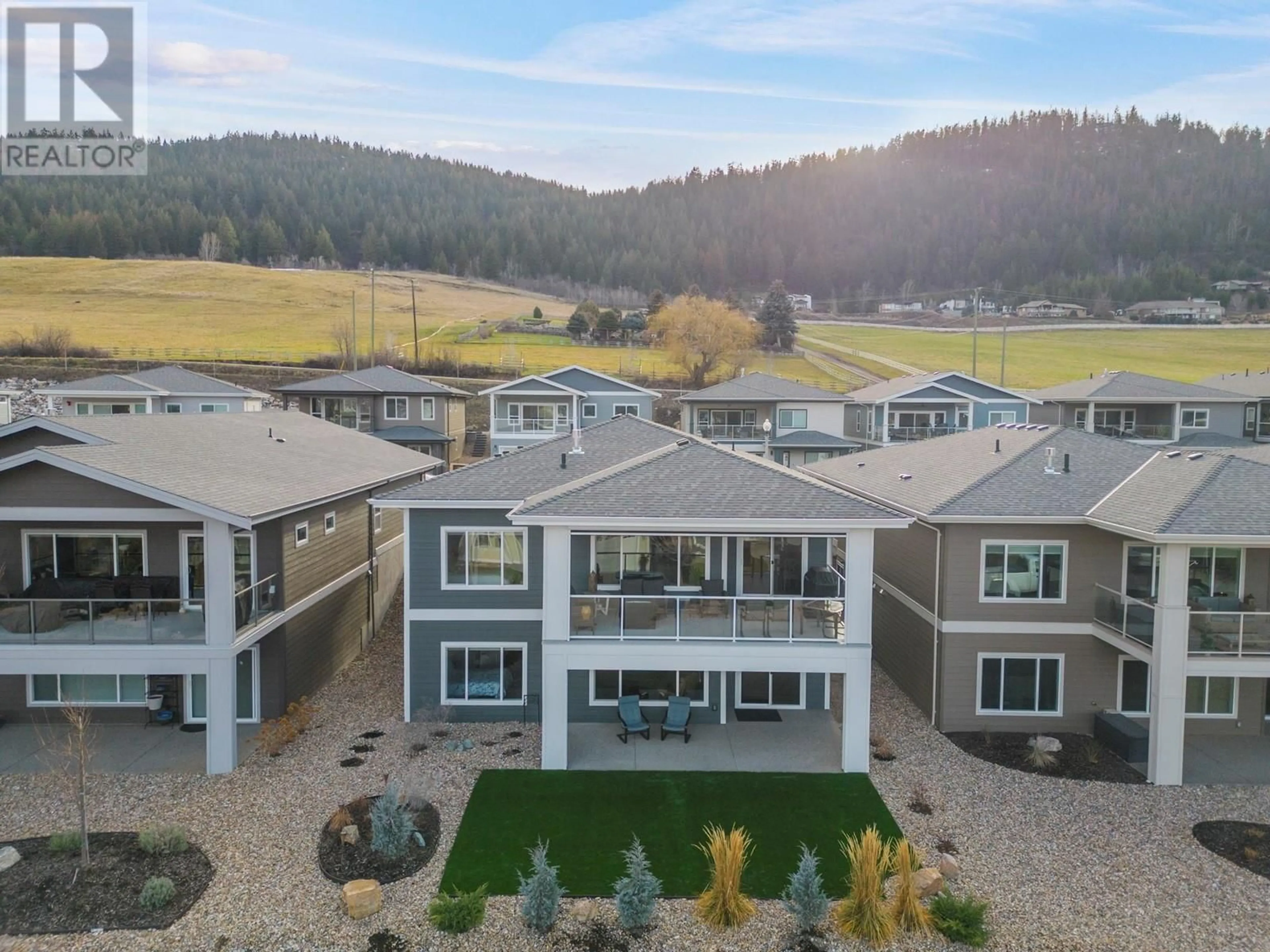 A pic from outside/outdoor area/front of a property/back of a property/a pic from drone, mountain view for 7760 Okananagan Landing Road Unit# 103, Vernon British Columbia V1H1Z4