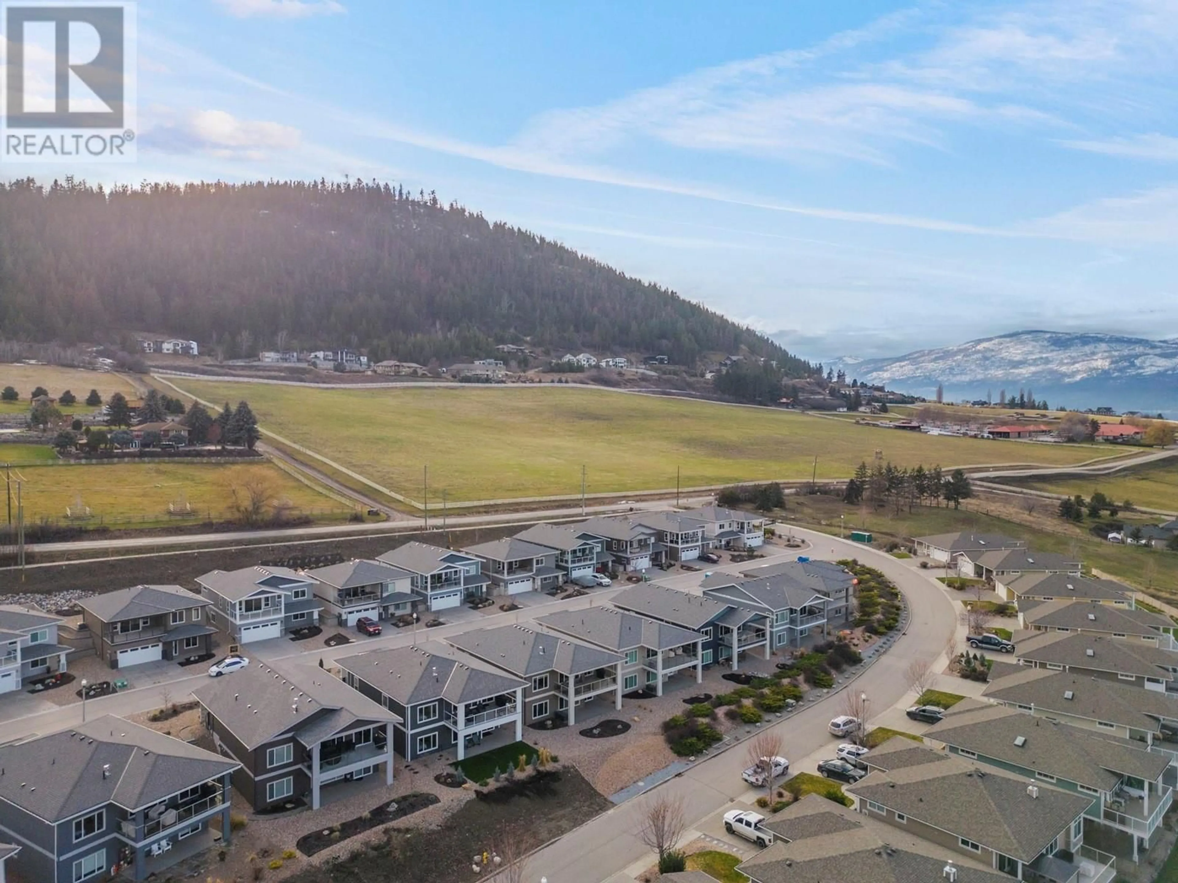 A pic from outside/outdoor area/front of a property/back of a property/a pic from drone, water/lake/river/ocean view for 7760 Okananagan Landing Road Unit# 103, Vernon British Columbia V1H1Z4