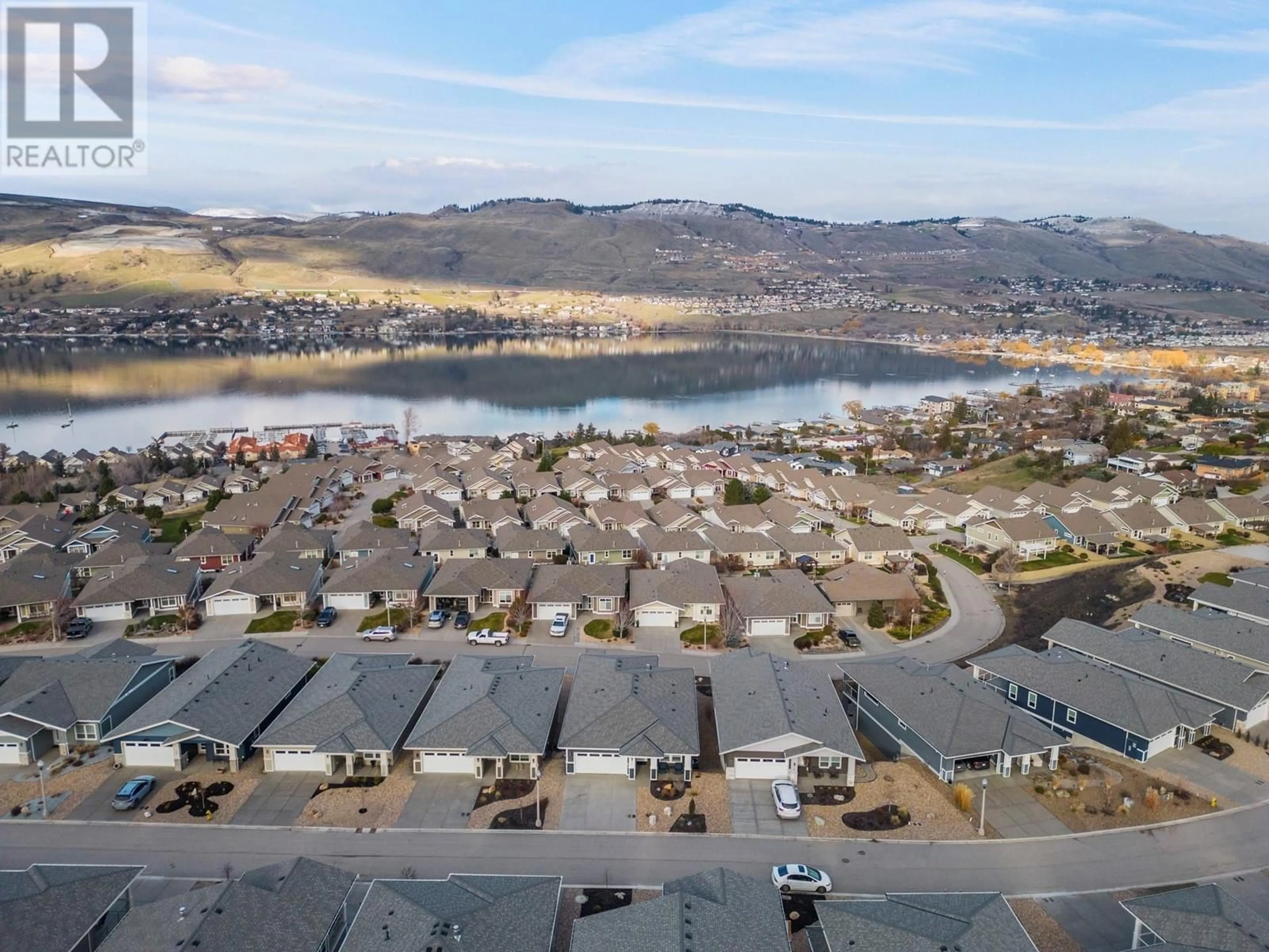 A pic from outside/outdoor area/front of a property/back of a property/a pic from drone, water/lake/river/ocean view for 7760 Okananagan Landing Road Unit# 103, Vernon British Columbia V1H1Z4