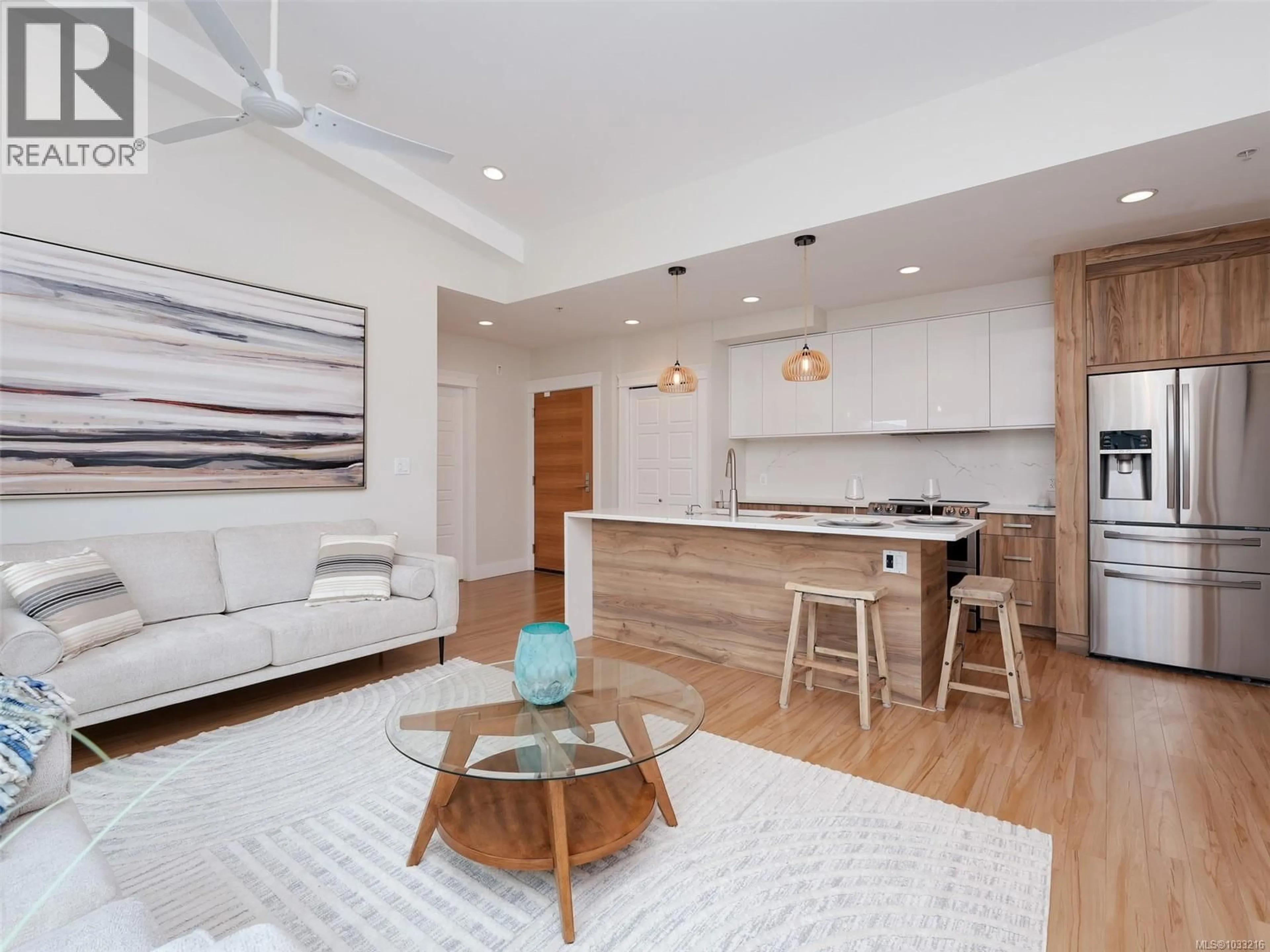 Open concept kitchen, wood/laminate floor for 403 - 7161 WEST SAANICH ROAD, Central Saanich British Columbia V8M1P7