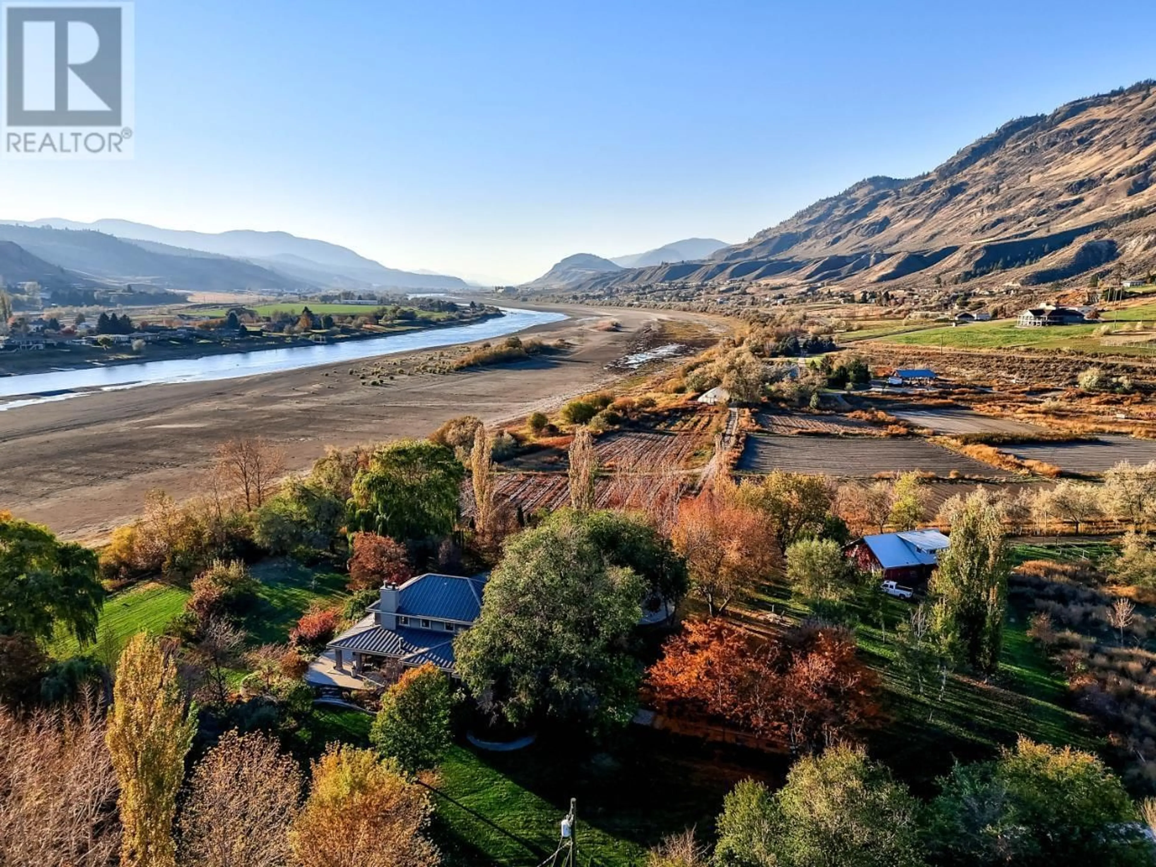 A pic from outside/outdoor area/front of a property/back of a property/a pic from drone, water/lake/river/ocean view for 3418 SHUSWAP  E ROAD, Kamloops British Columbia V2H1T2