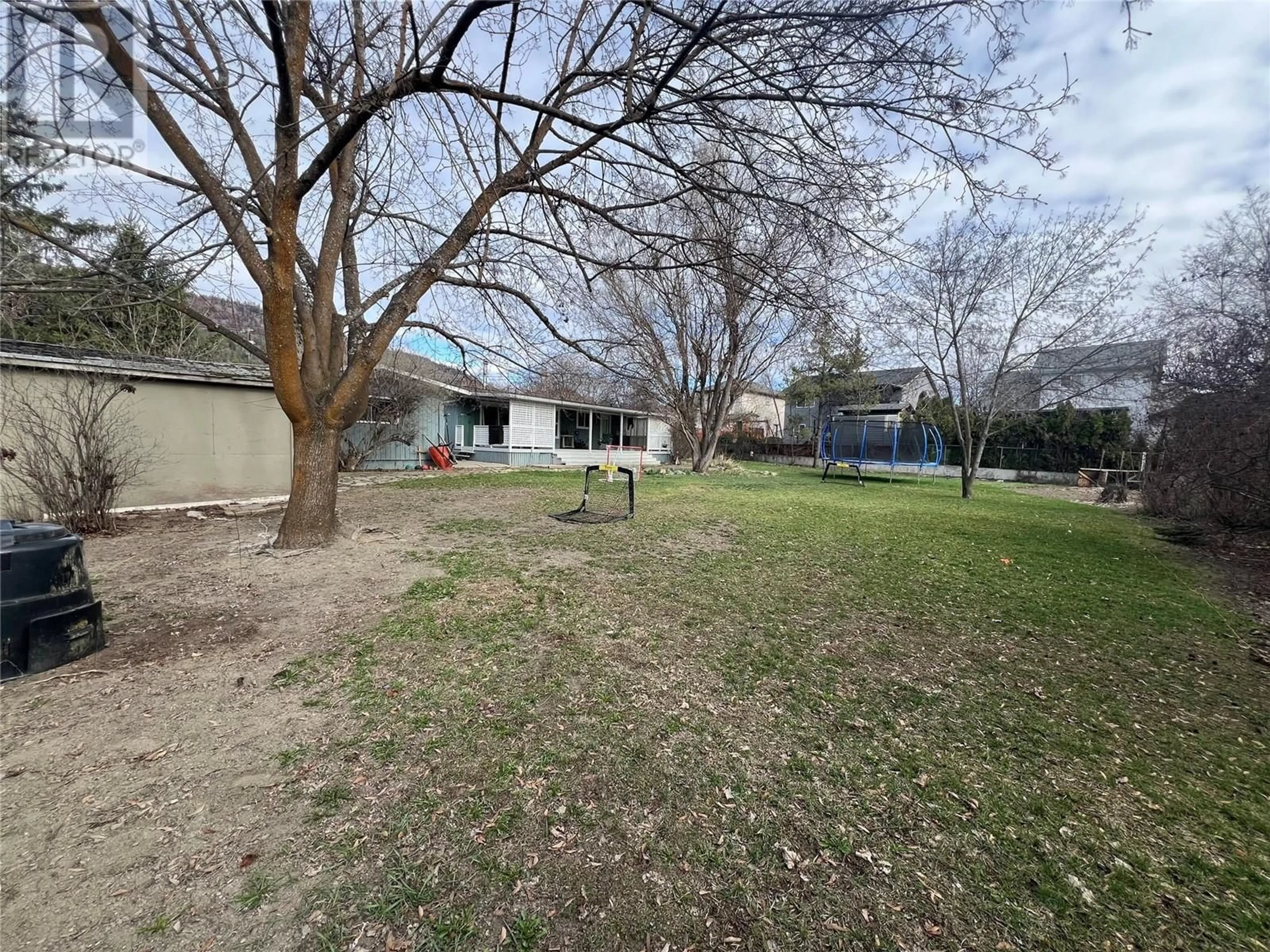 A pic from outside/outdoor area/front of a property/back of a property/a pic from drone, unknown for 157 CARIBOO ROAD, Kelowna British Columbia V1V2E4