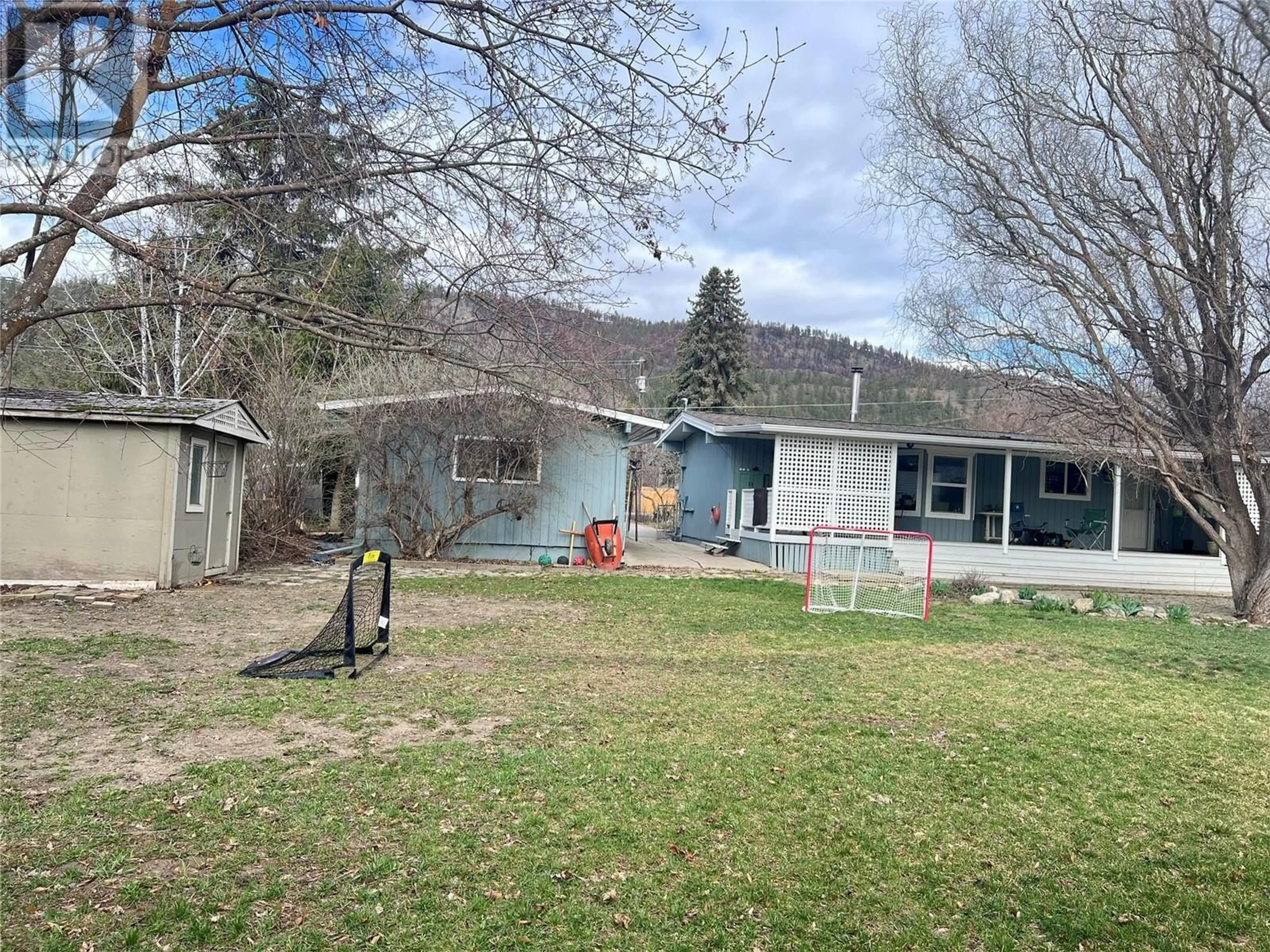 A pic from outside/outdoor area/front of a property/back of a property/a pic from drone, street for 157 Cariboo Road, Kelowna British Columbia V1V2E4