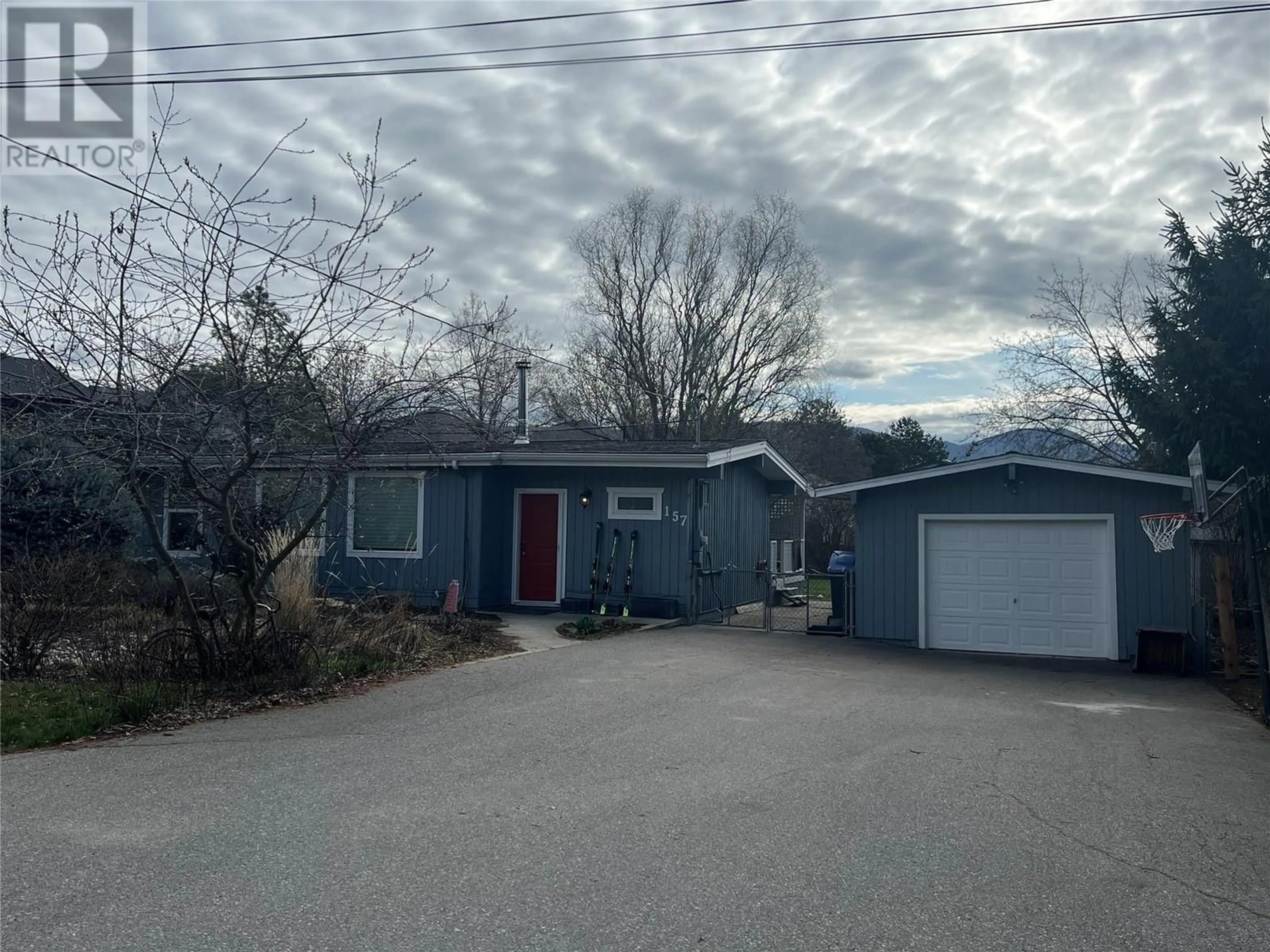 A pic from outside/outdoor area/front of a property/back of a property/a pic from drone, street for 157 Cariboo Road, Kelowna British Columbia V1V2E4