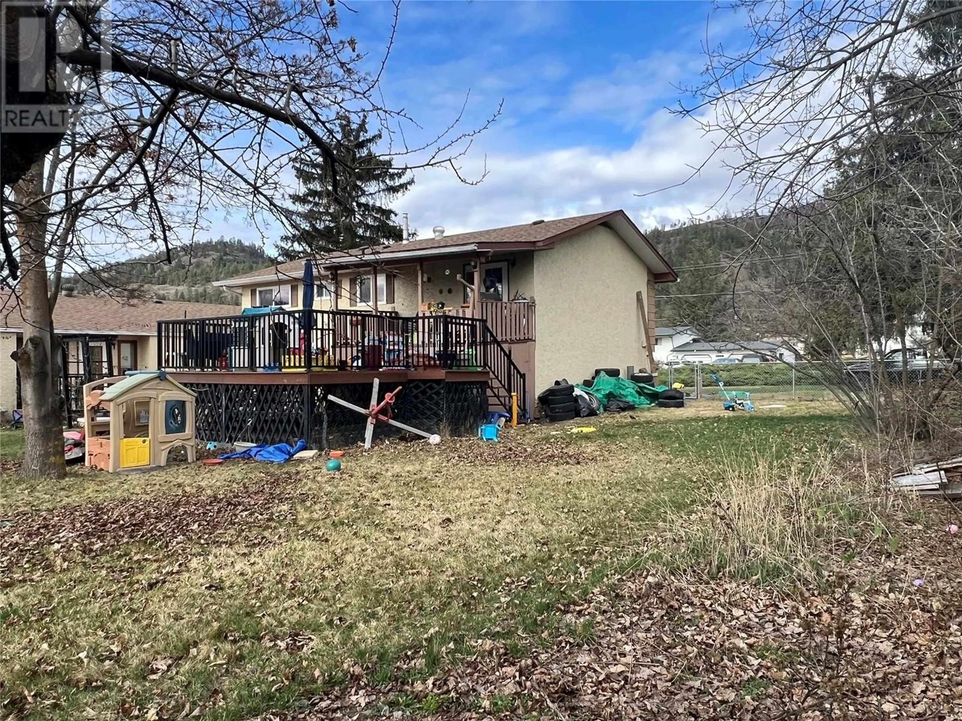 A pic from outside/outdoor area/front of a property/back of a property/a pic from drone, mountain view for 163 Cariboo Road, Kelowna British Columbia V1V2E4