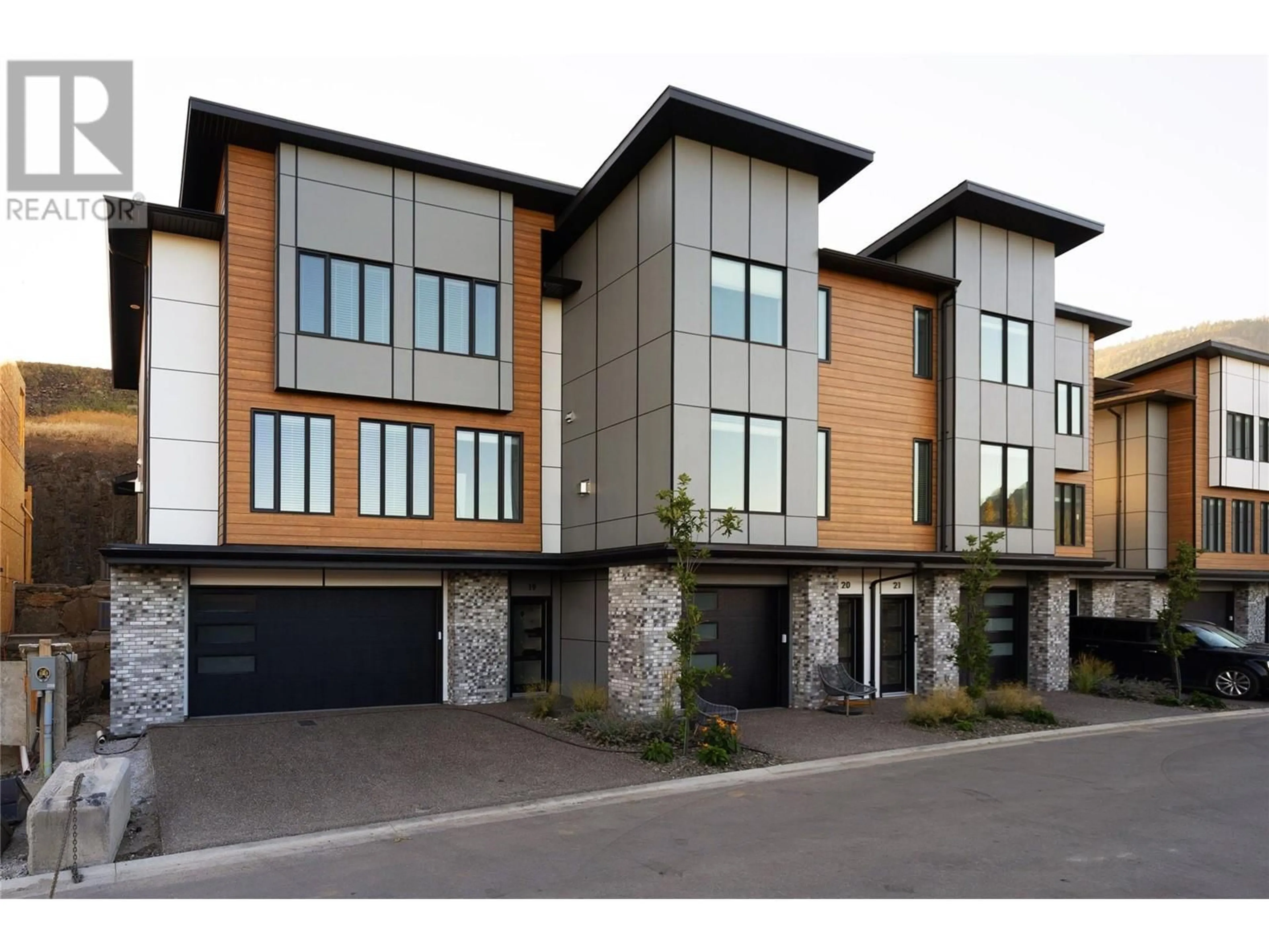 Home with brick exterior material, street for 2835 Canyon Crest Drive Unit# 23, West Kelowna British Columbia V4T0E3