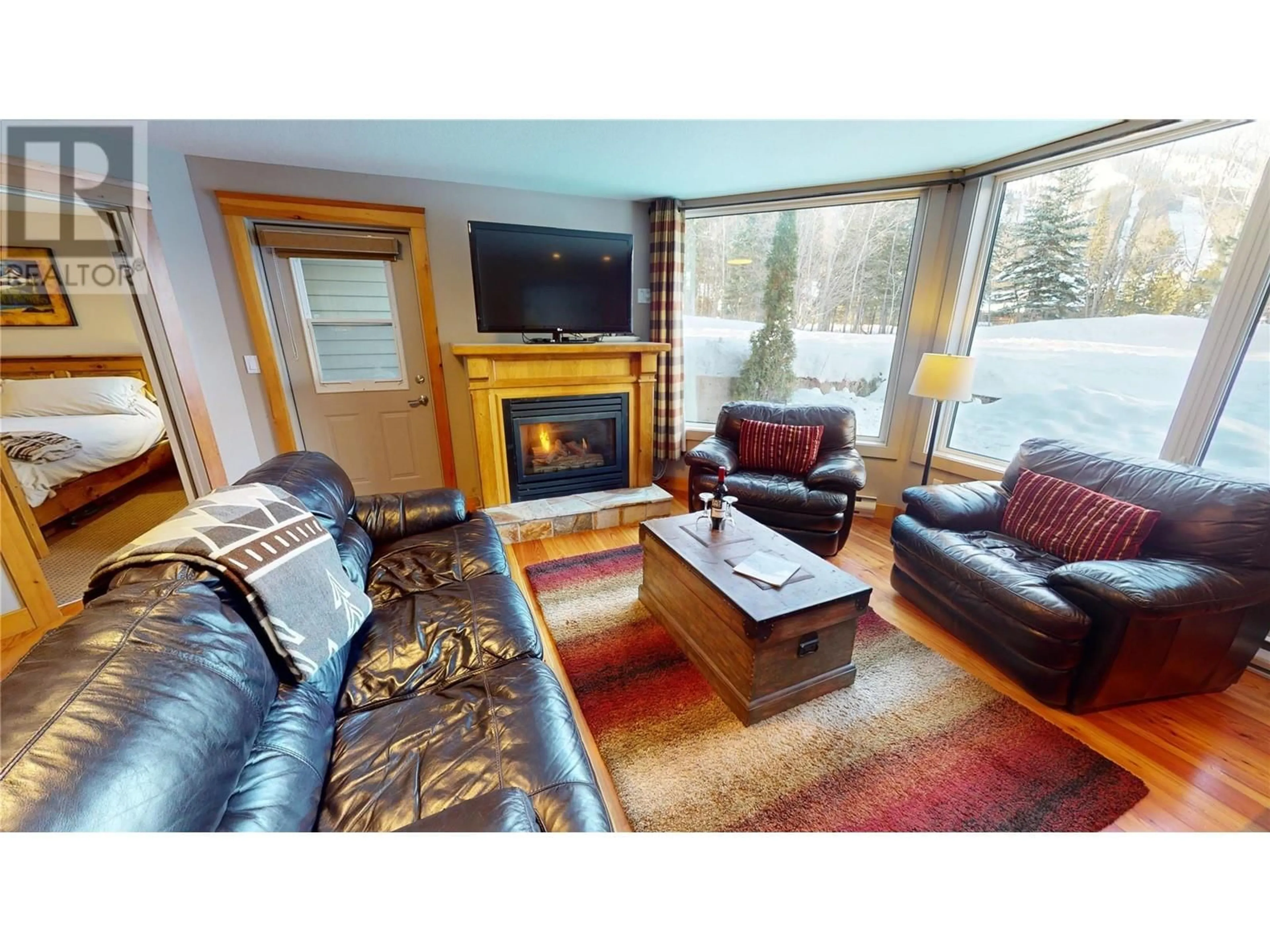 Living room with furniture, wood/laminate floor for 4559 Timberline Cresent Crescent Unit# 2, Fernie British Columbia V0B1M6