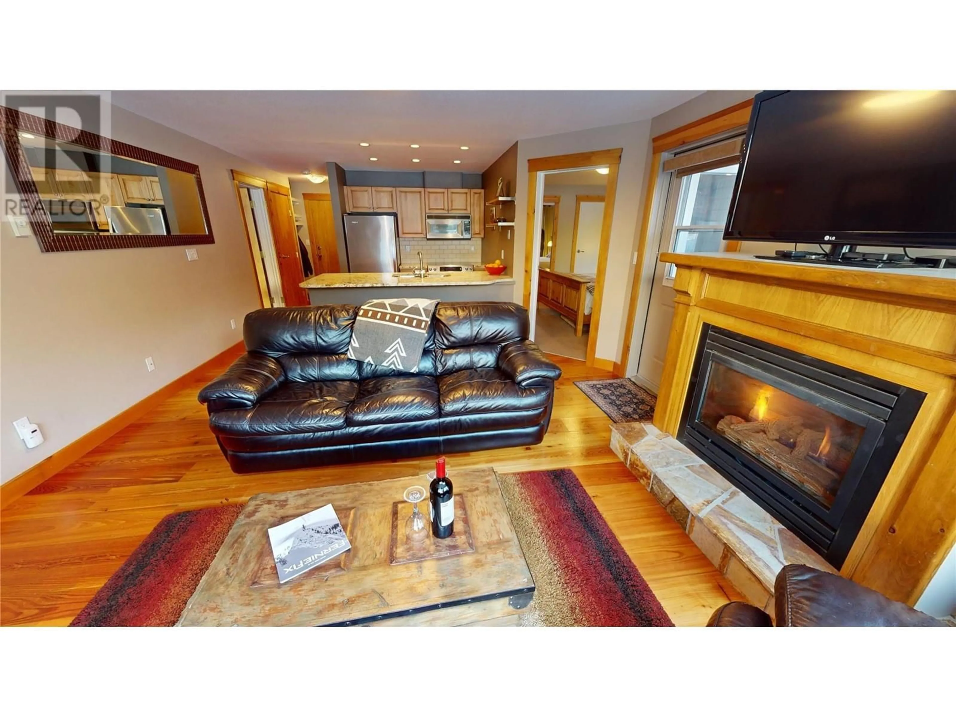 Living room with furniture, wood/laminate floor for 4559 Timberline Cresent Crescent Unit# 2, Fernie British Columbia V0B1M6