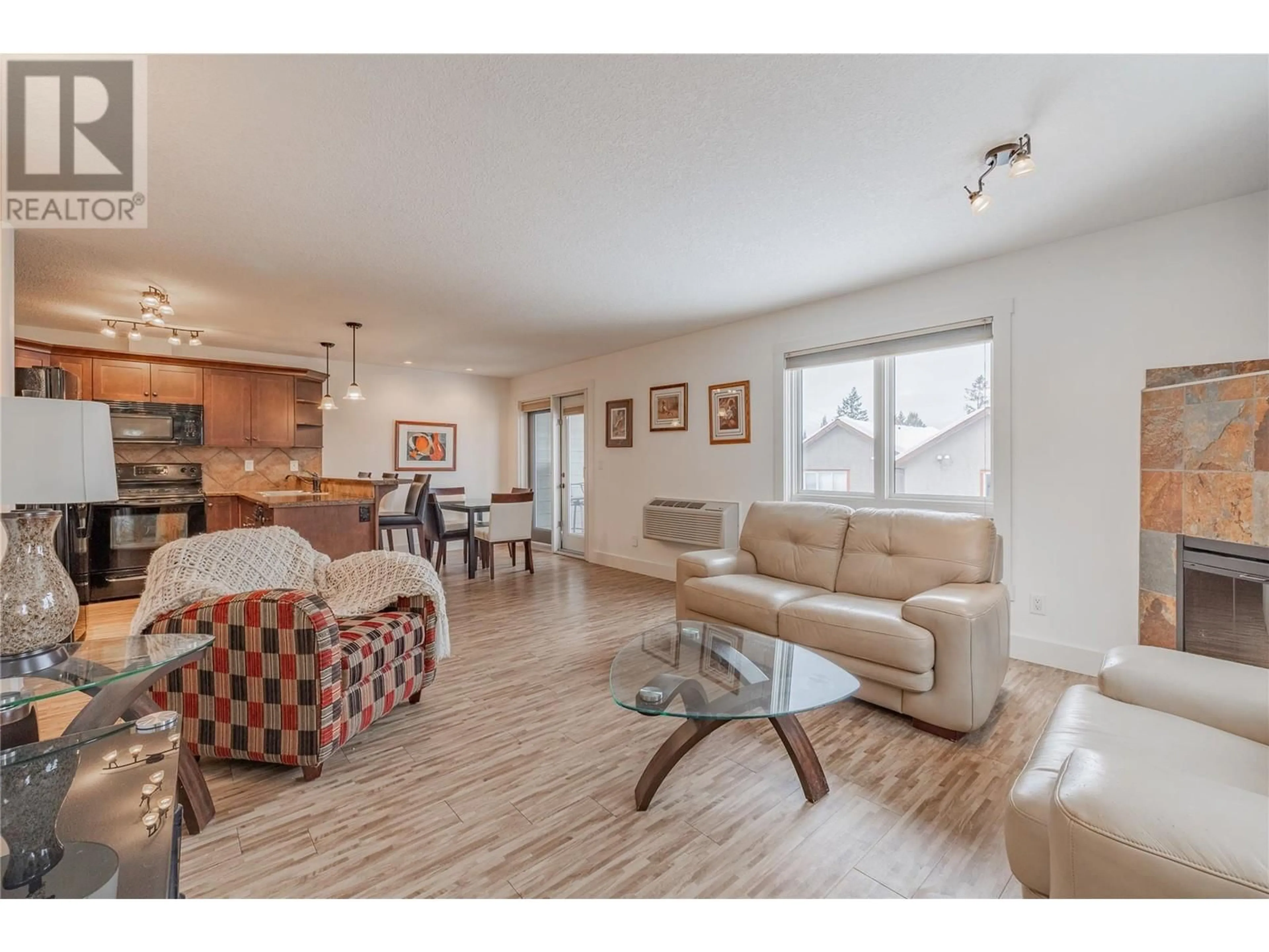 Living room with furniture, wood/laminate floor for 7337 Prospector Avenue Unit# 504, Radium Hot Springs British Columbia V0A1M0