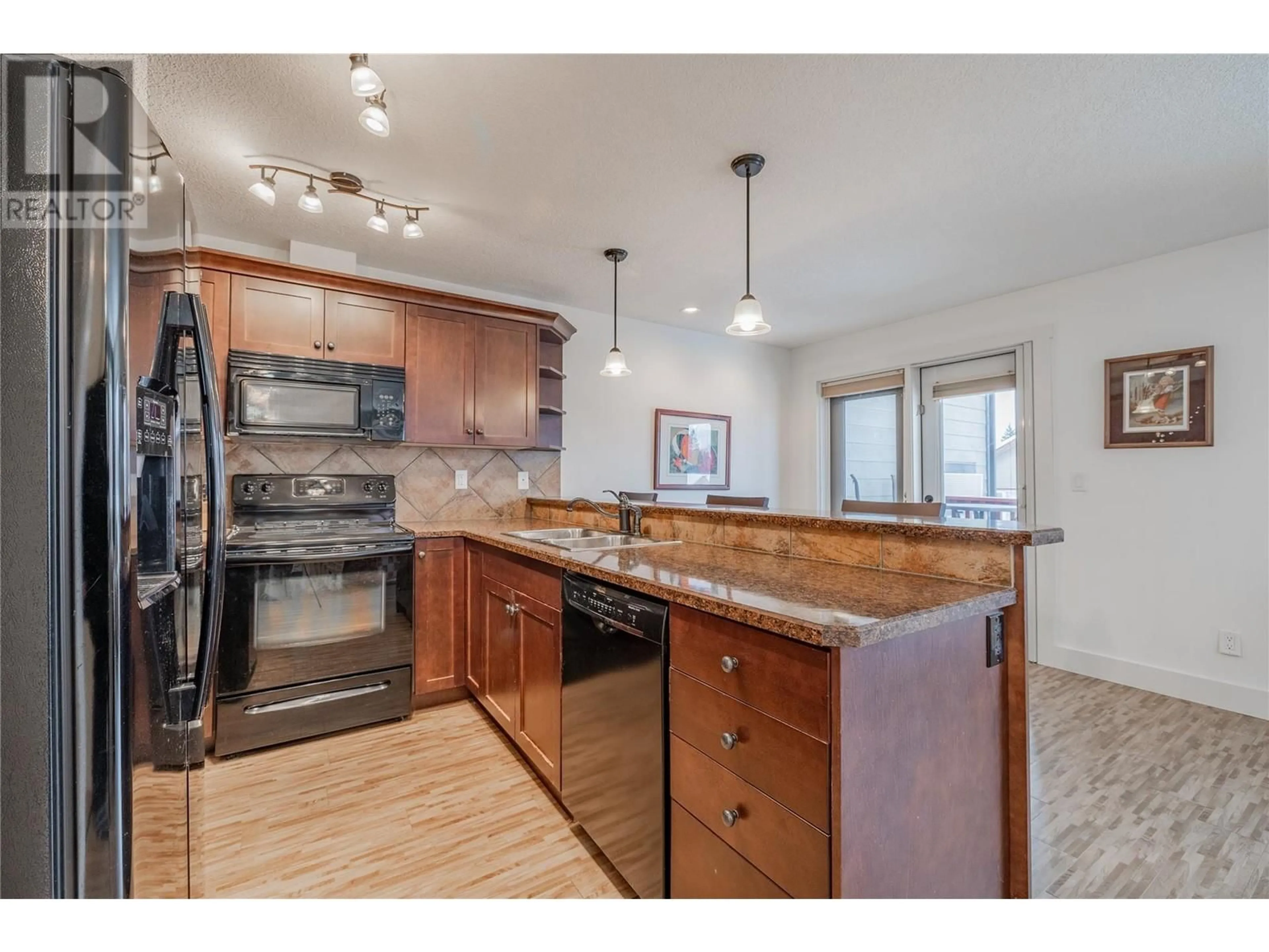 Open concept kitchen, unknown for 7337 Prospector Avenue Unit# 504, Radium Hot Springs British Columbia V0A1M0