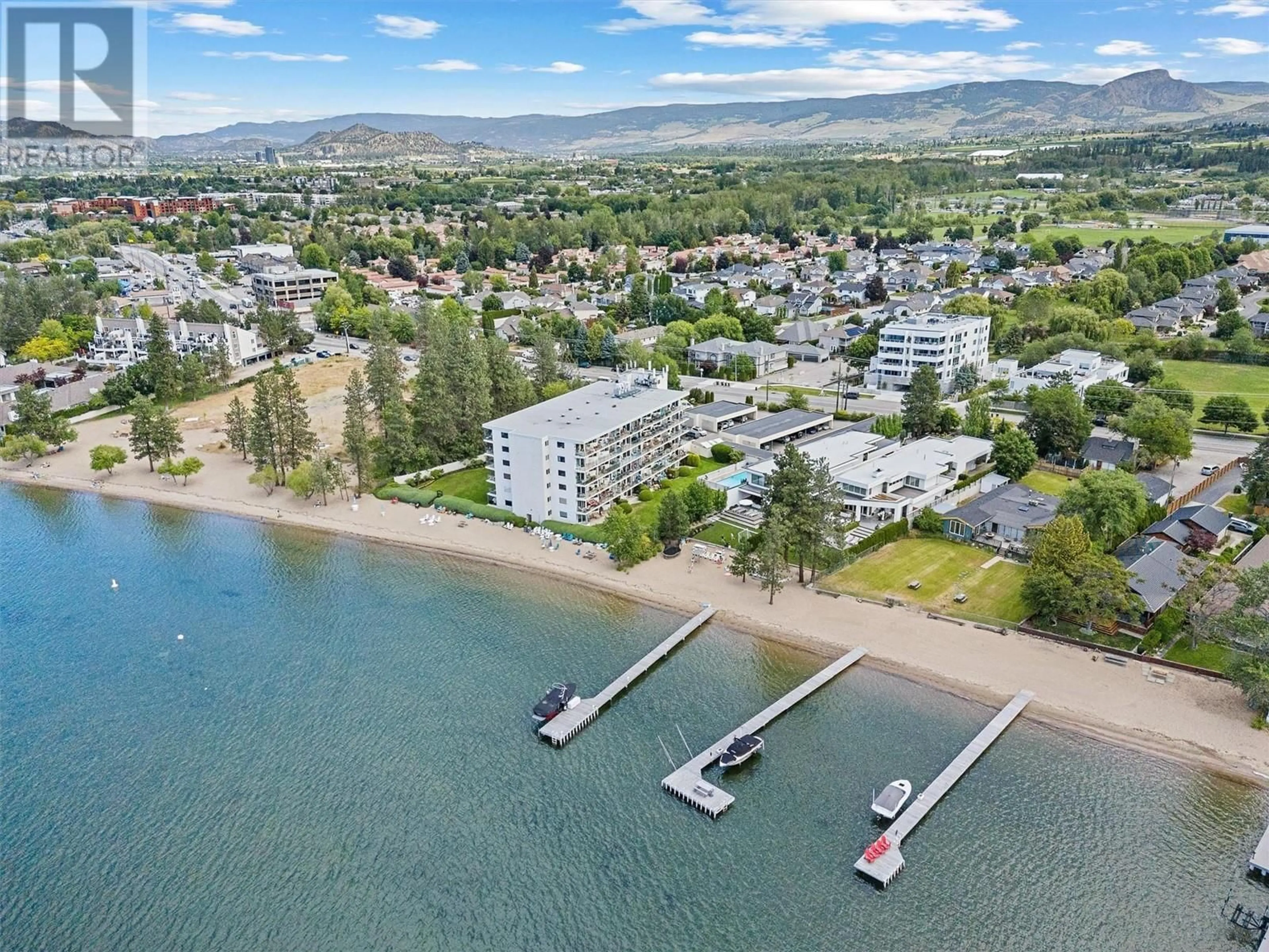 A pic from outside/outdoor area/front of a property/back of a property/a pic from drone, water/lake/river/ocean view for 4058 Lakeshore Road Unit# 202, Kelowna British Columbia V1W1V6