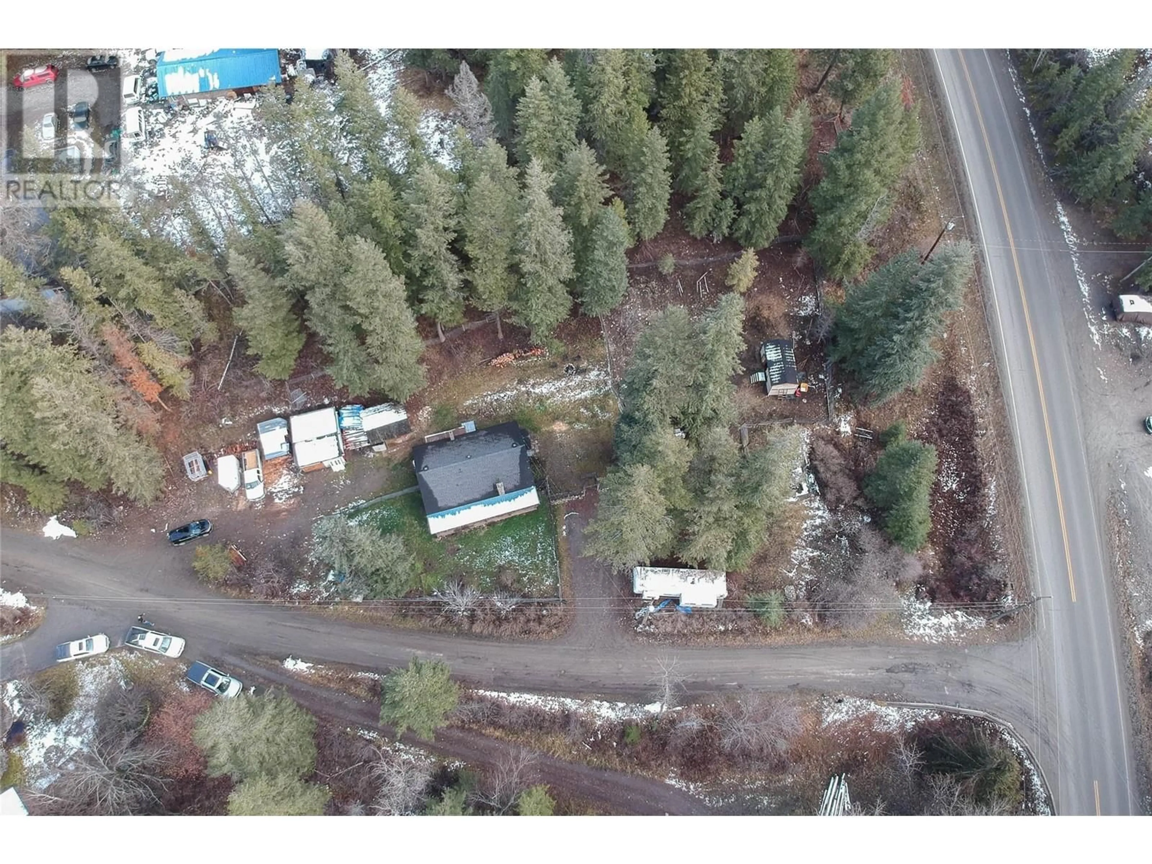 A pic from outside/outdoor area/front of a property/back of a property/a pic from drone, forest/trees view for 10 Chouinard Road, Cherryville British Columbia V0E2G3