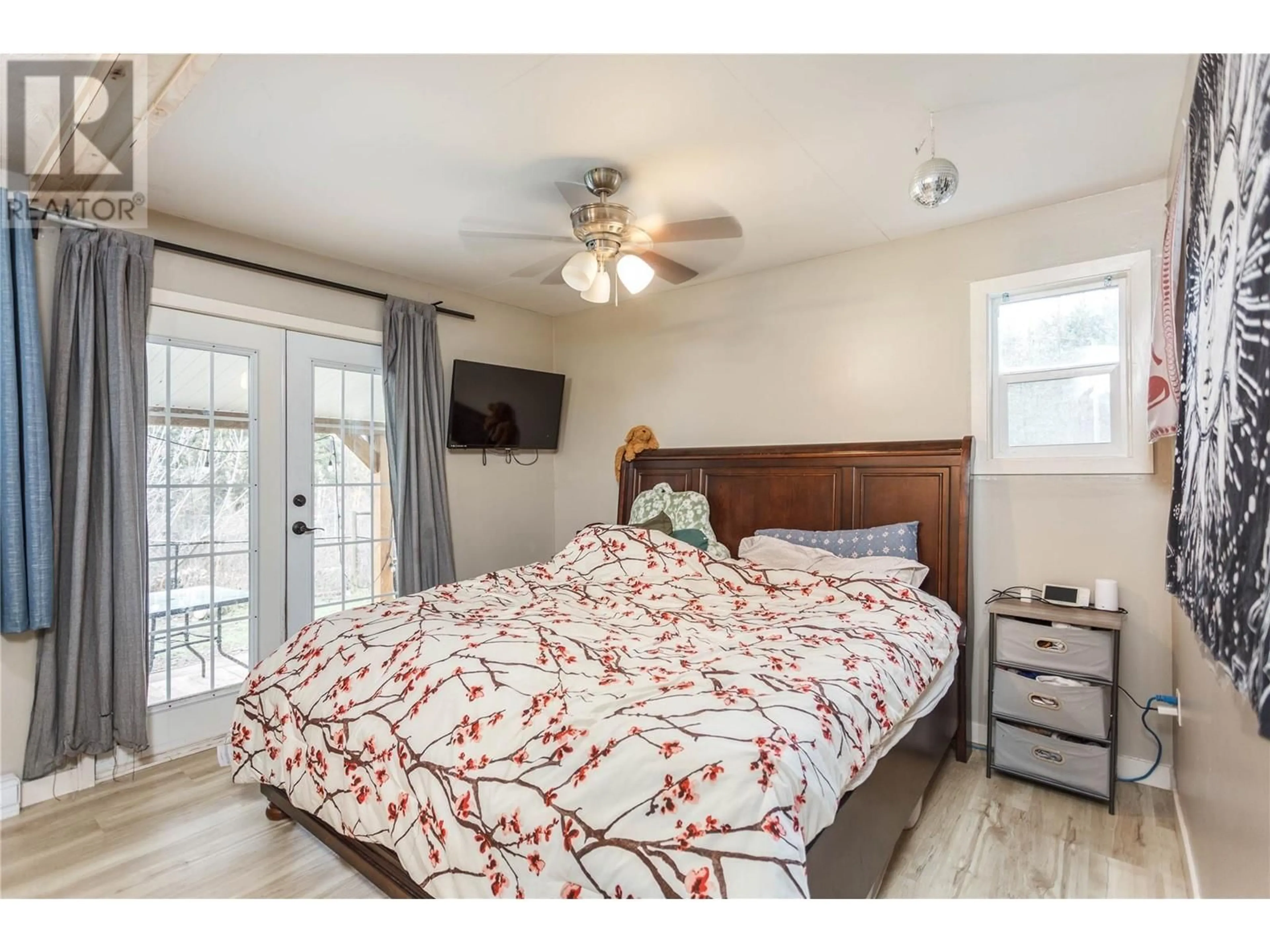 Bedroom with bed, wood/laminate floor for 10 Chouinard Road, Cherryville British Columbia V0E2G3