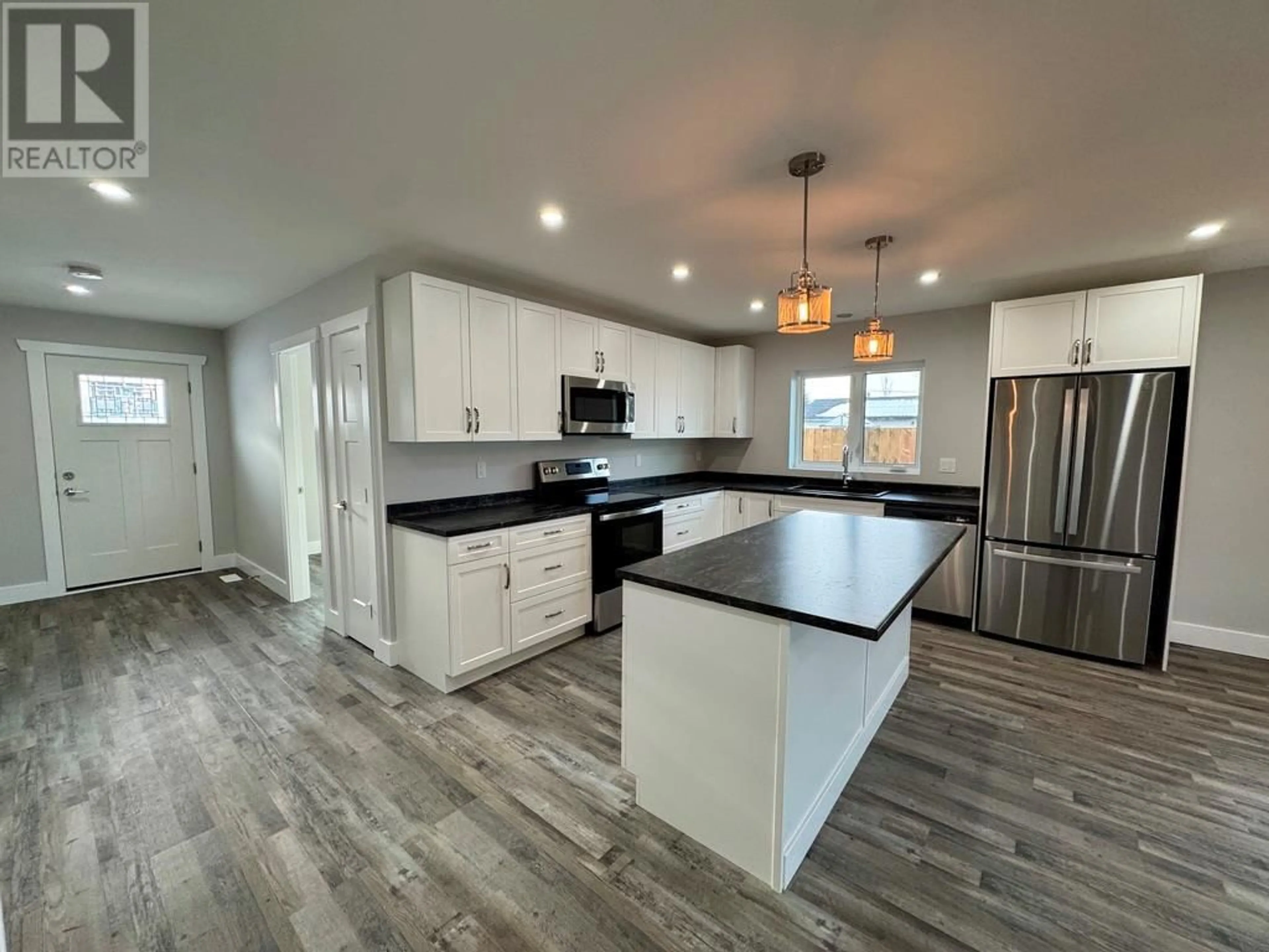 Open concept kitchen, unknown for 1009 116 Avenue, Dawson Creek British Columbia V1G3E4