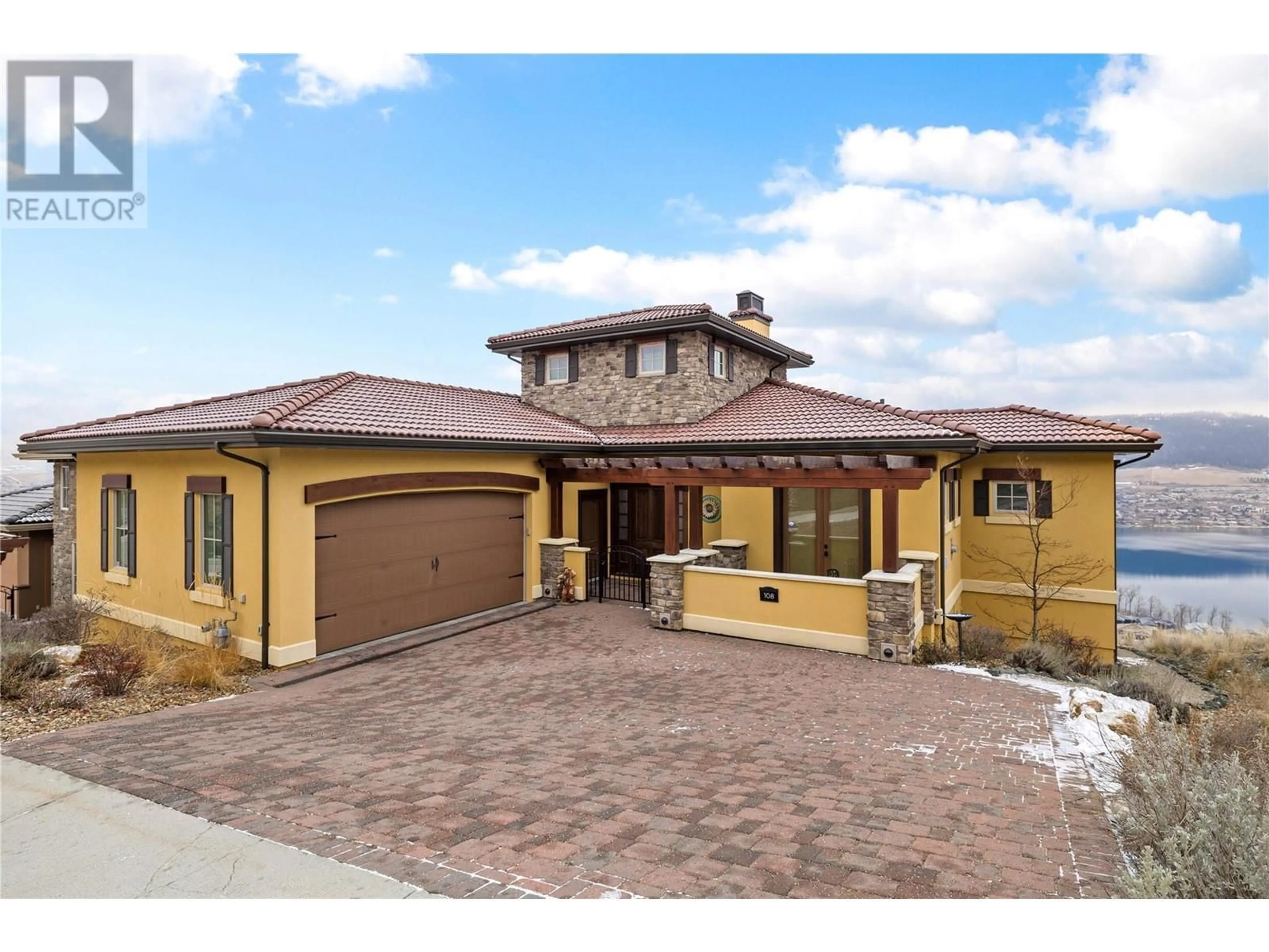 Home with brick exterior material, street for 108 Vineyard Way, Vernon British Columbia V1H1Z7