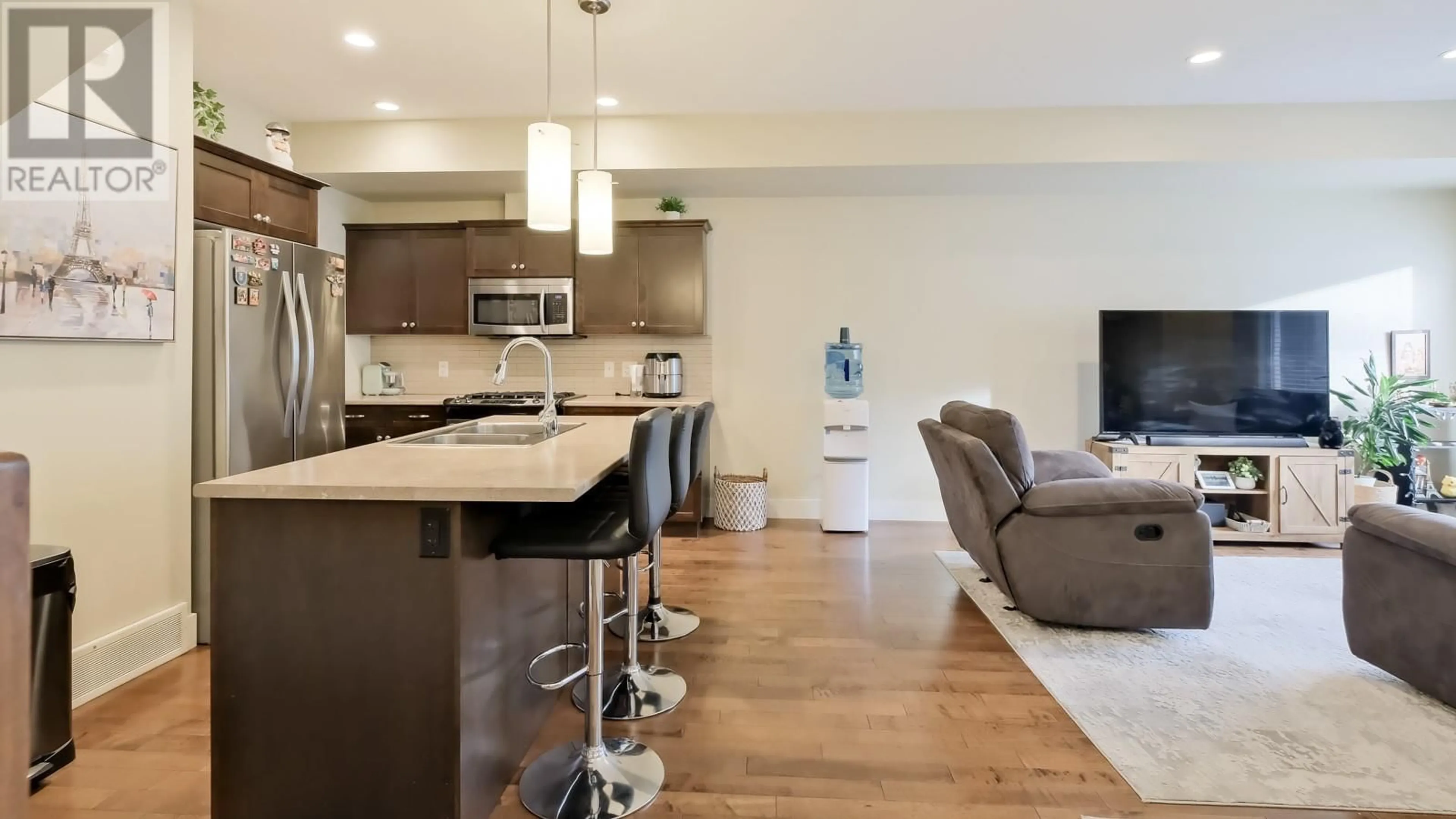 Open concept kitchen, wood/laminate floor for 600 Boynton Place Unit# 43, Kelowna British Columbia V1V3B8