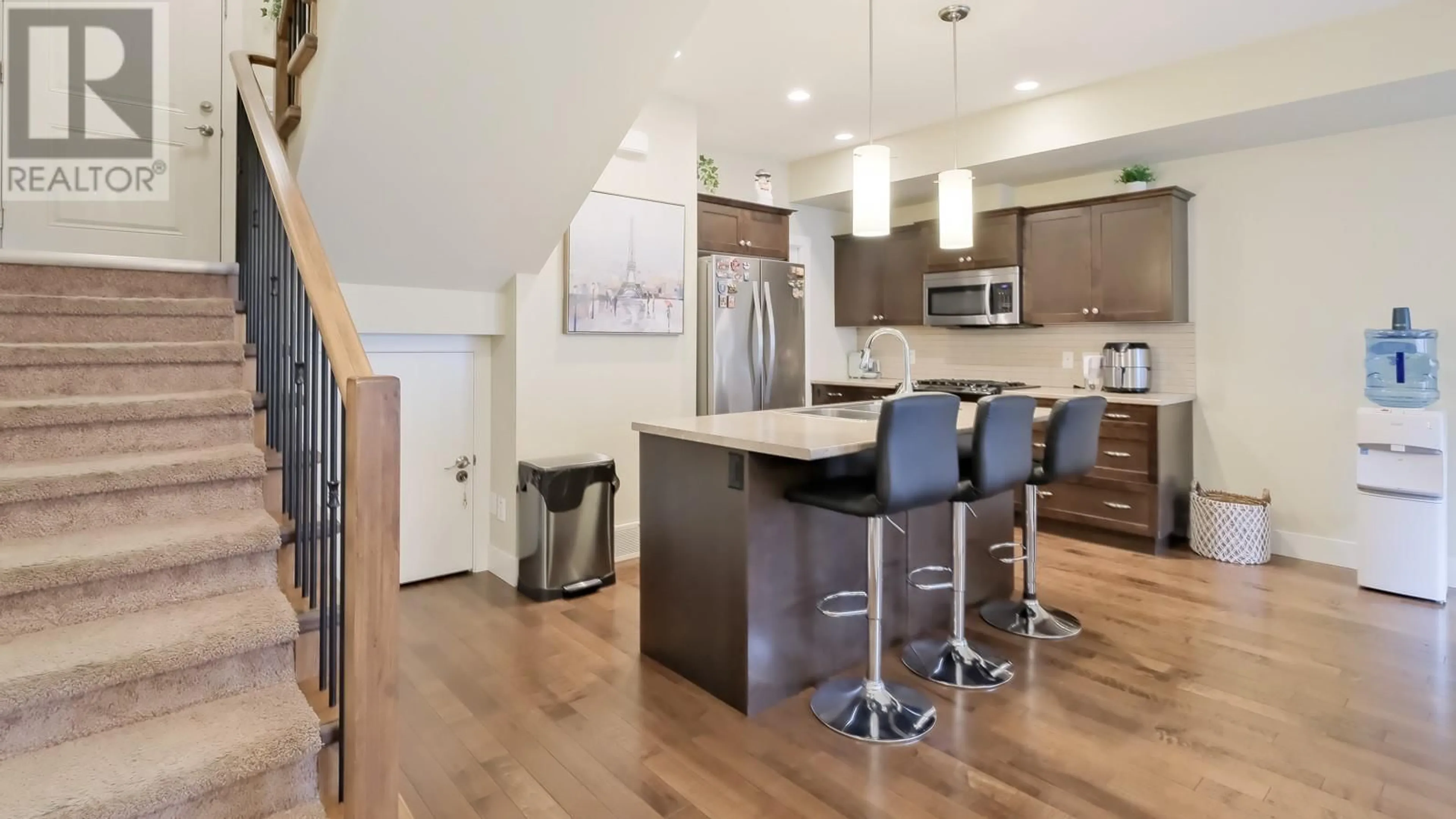 Open concept kitchen, wood/laminate floor for 600 Boynton Place Unit# 43, Kelowna British Columbia V1V3B8