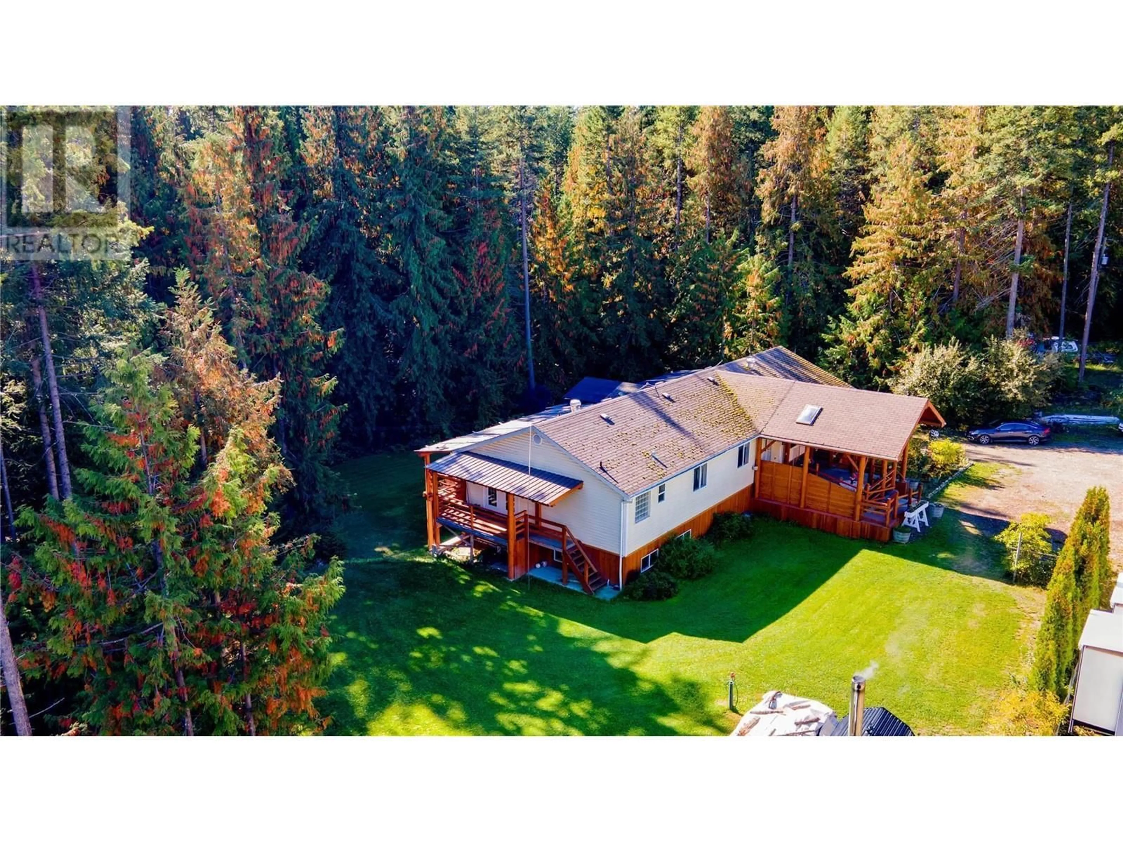 A pic from outside/outdoor area/front of a property/back of a property/a pic from drone, forest/trees view for 2681 Trans Canada Highway, Sorrento British Columbia V0E2W0