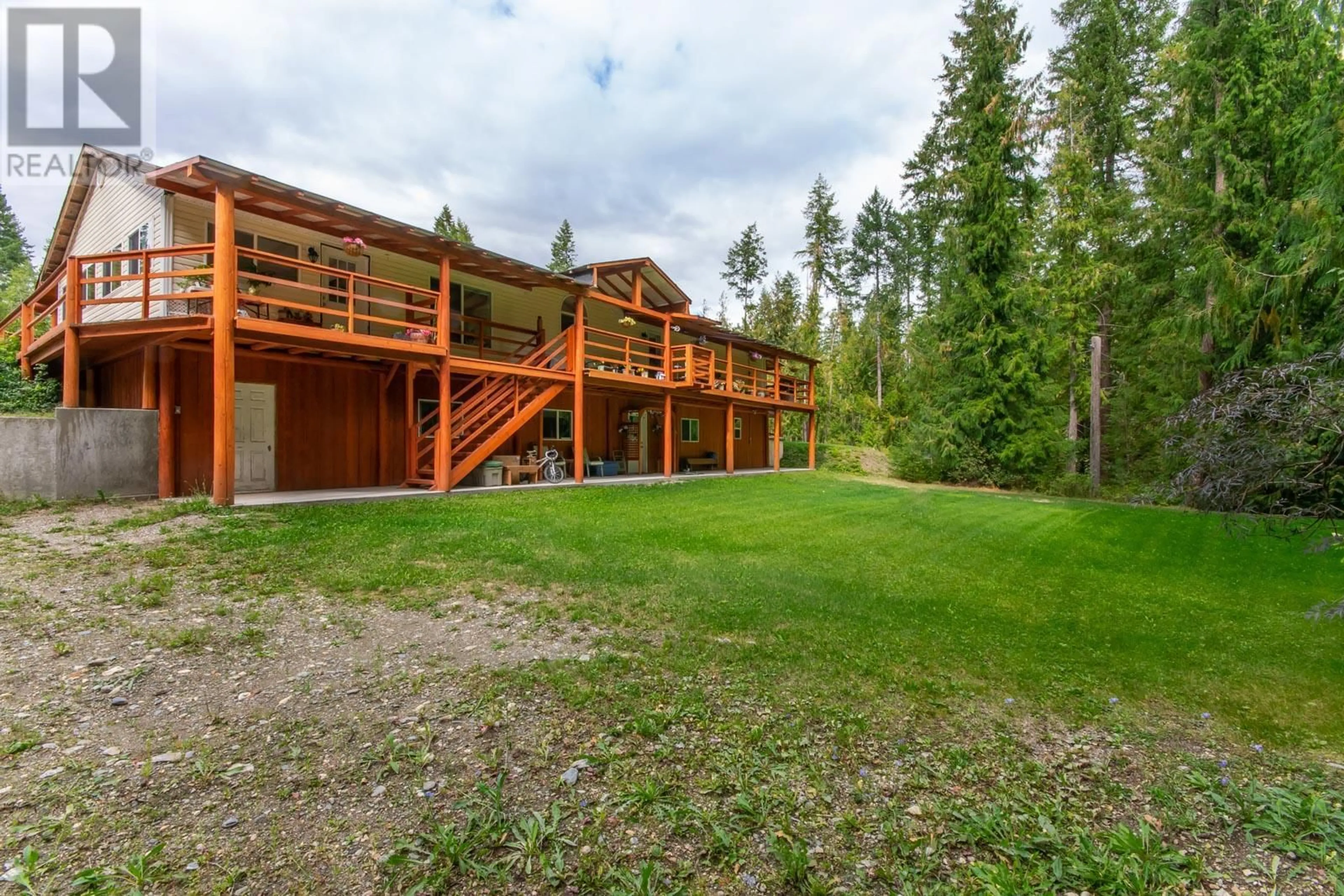 A pic from outside/outdoor area/front of a property/back of a property/a pic from drone, forest/trees view for 2681 Trans Canada Highway, Sorrento British Columbia V0E2W0