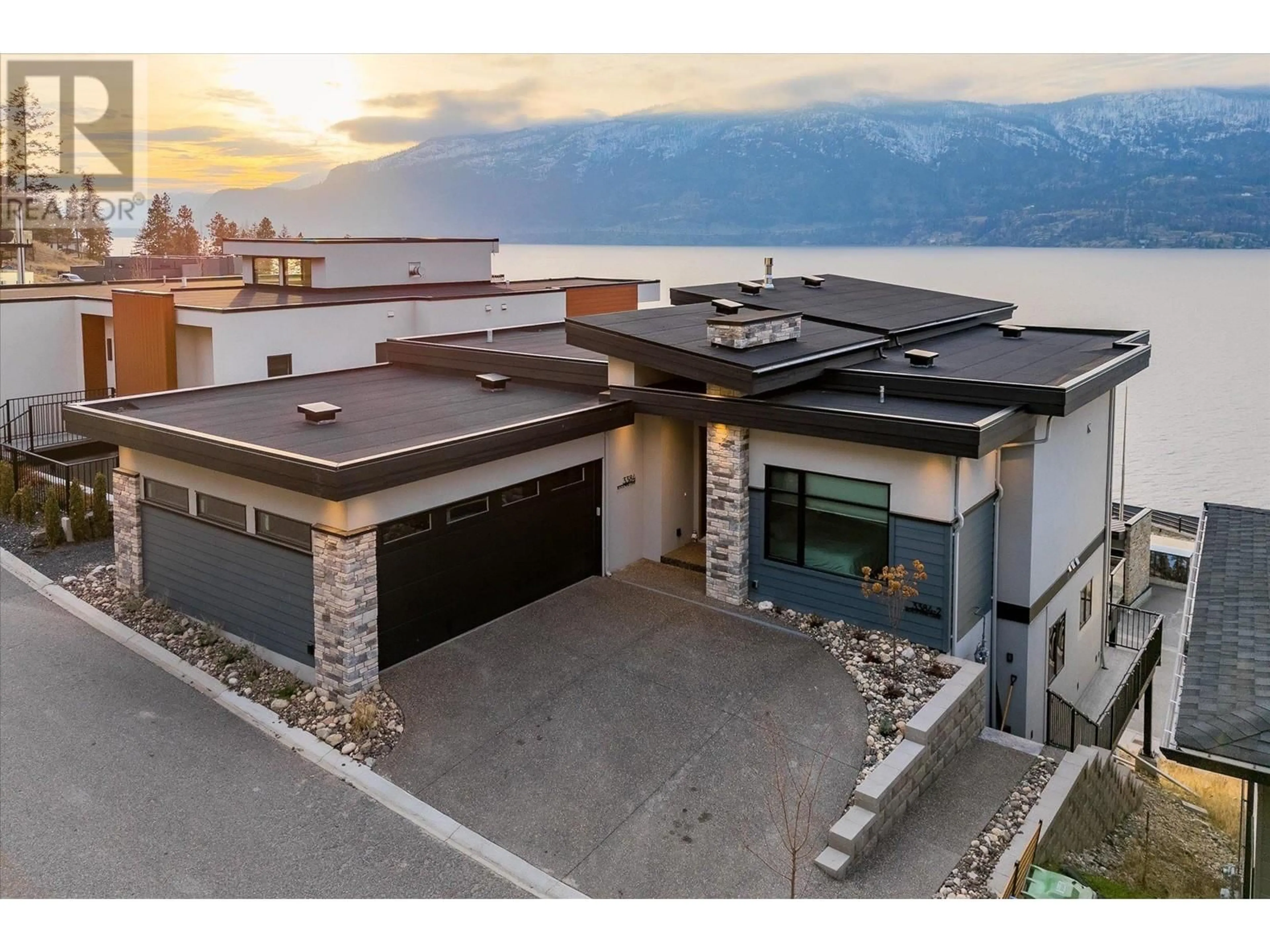 A pic from outside/outdoor area/front of a property/back of a property/a pic from drone, mountain view for 3384 Black Pine Lane, Kelowna British Columbia V1V3G1