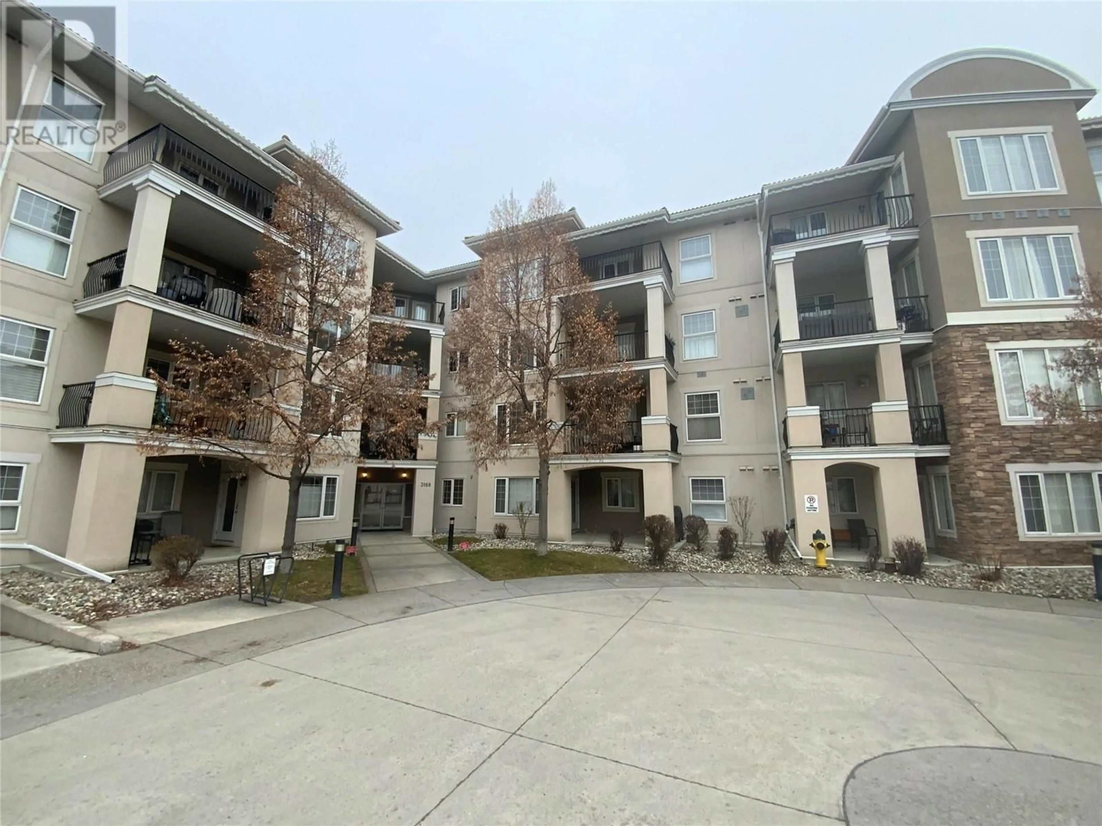 A pic from outside/outdoor area/front of a property/back of a property/a pic from drone, building for 3168 Via Centrale Road Unit# 1406, Kelowna British Columbia V1V2R6