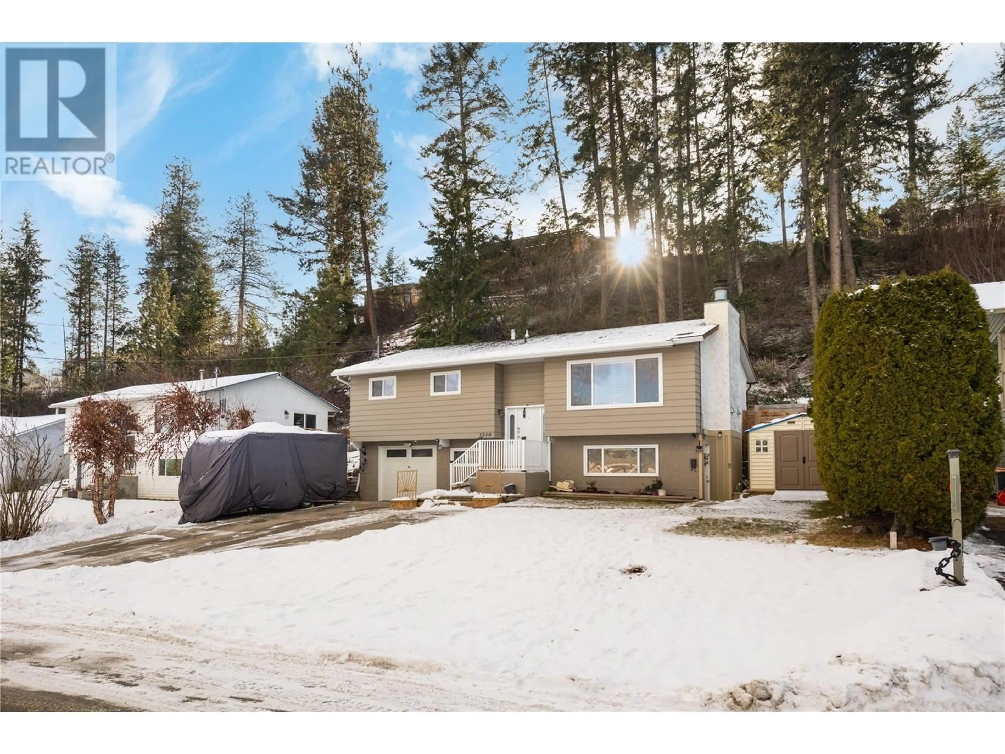 Home with vinyl exterior material, street for 3240 McGinnis Road, West Kelowna British Columbia V4T1A8