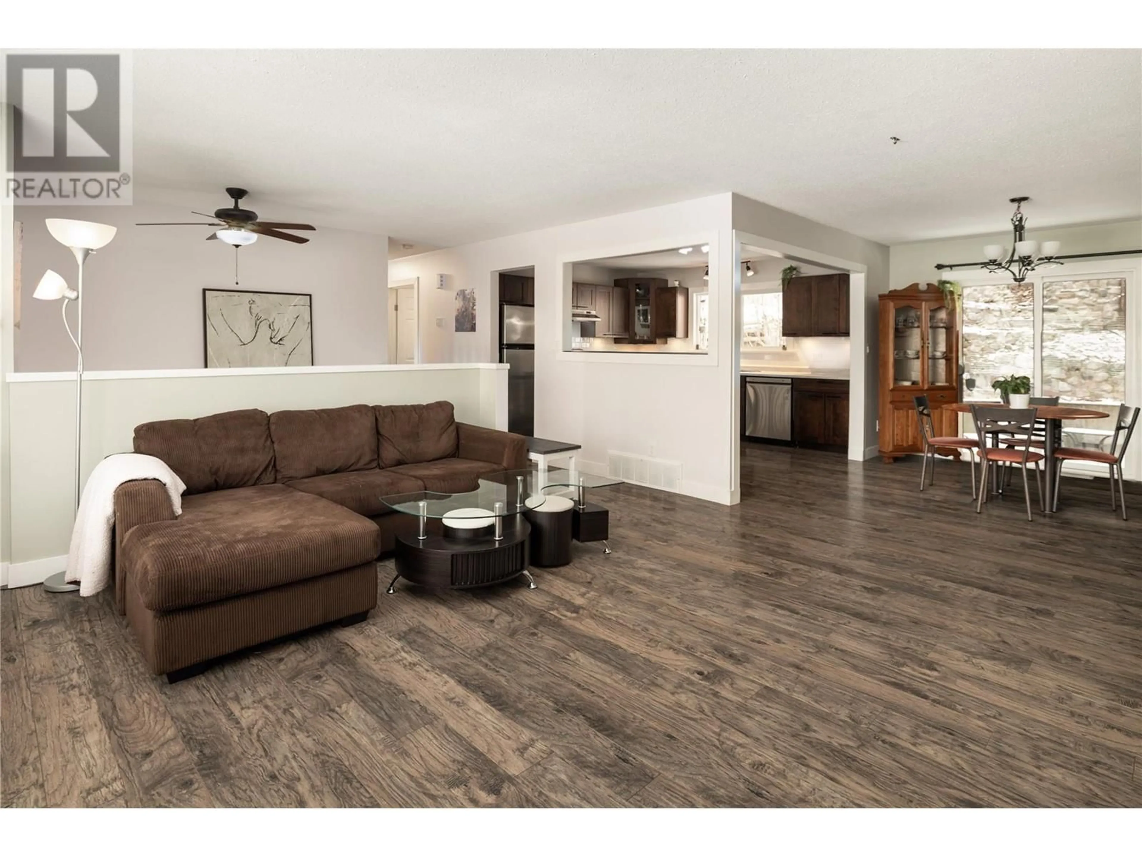 Living room with furniture, wood/laminate floor for 3240 McGinnis Road, West Kelowna British Columbia V4T1A8