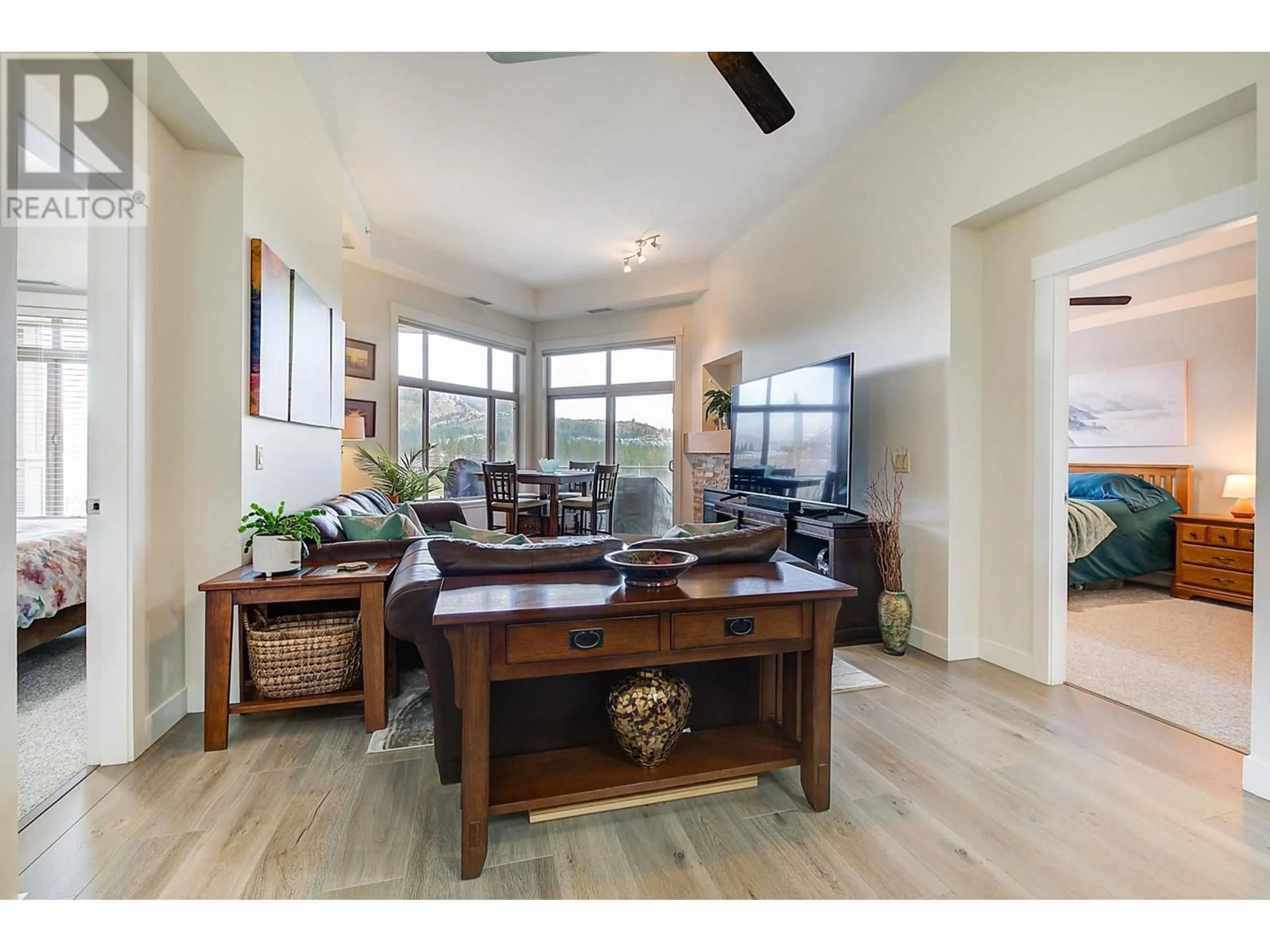 Living room with furniture, wood/laminate floor for 513 - 3545 CARRINGTON ROAD, Westbank British Columbia V4T3A1