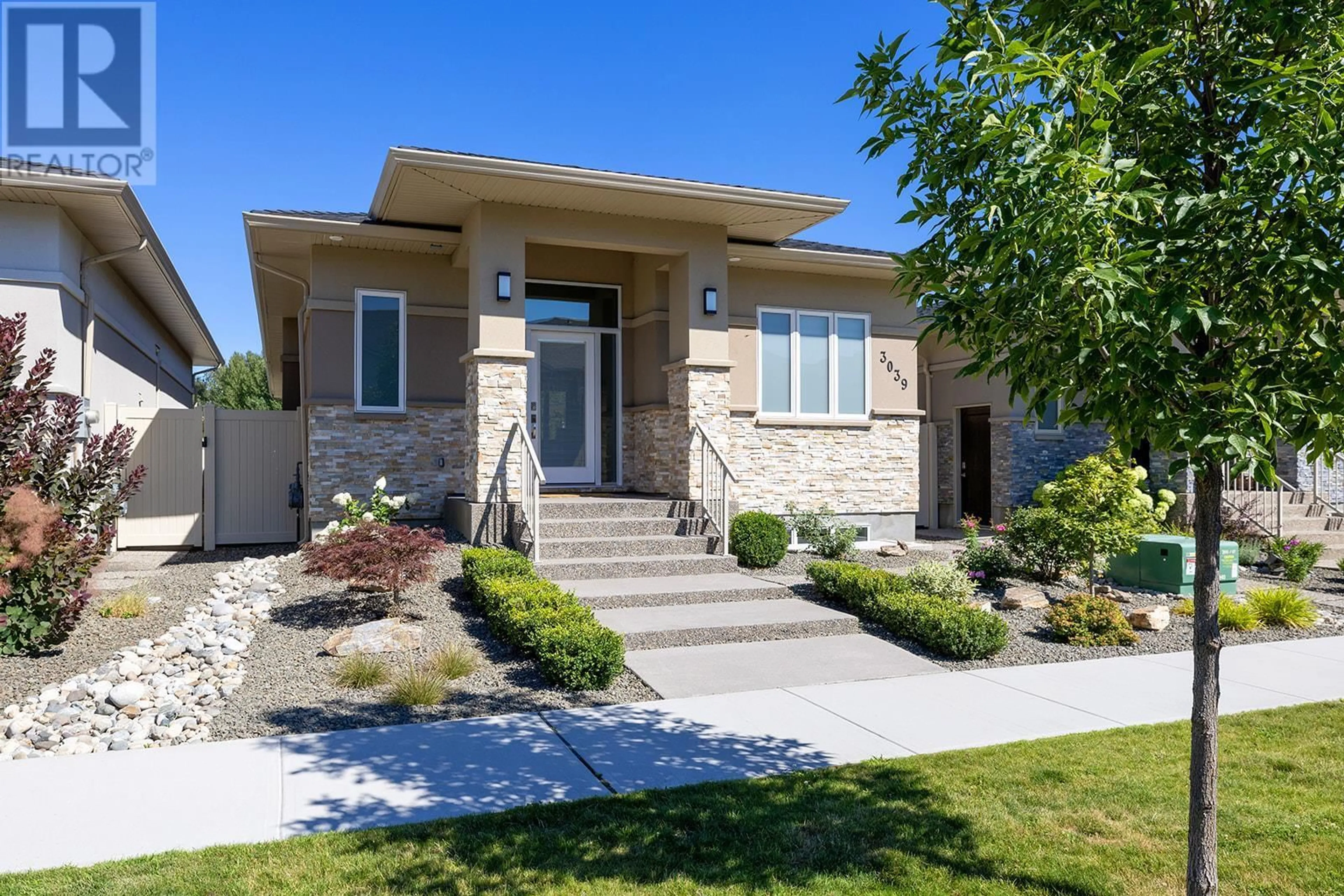 Home with brick exterior material, street for 3039 Burtch Road, Kelowna British Columbia V1W3Z4