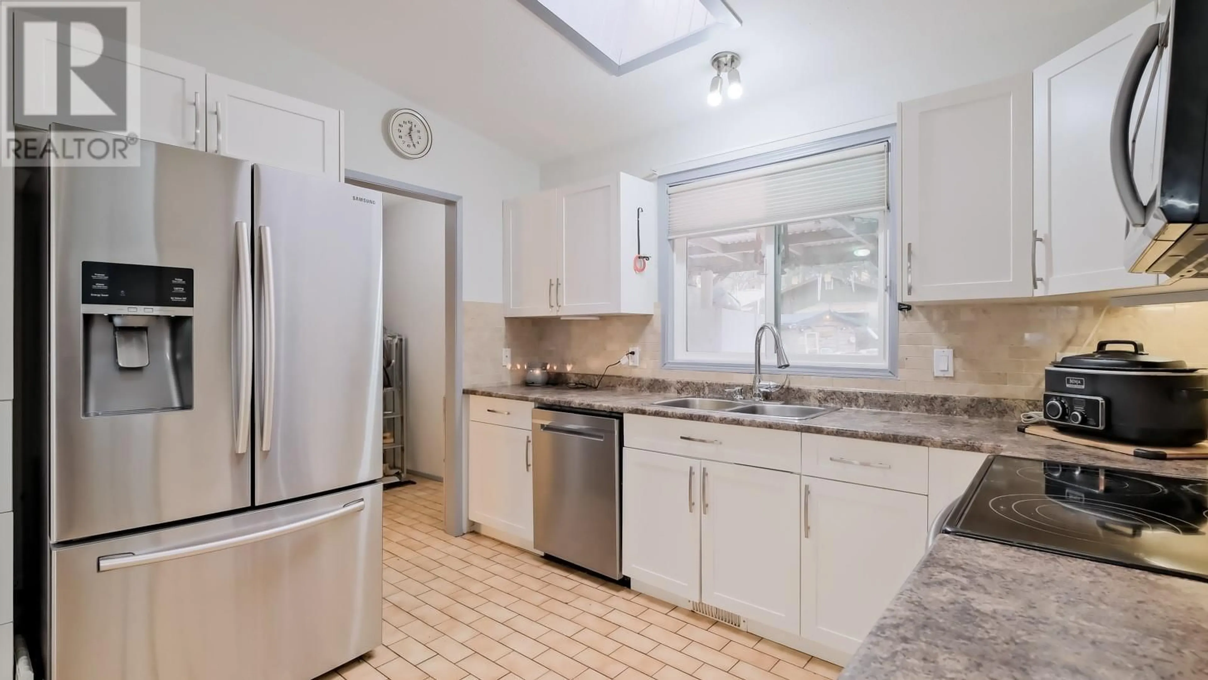 Standard kitchen, ceramic/tile floor for 3498 Ficke Road, West Kelowna British Columbia V4T1H5