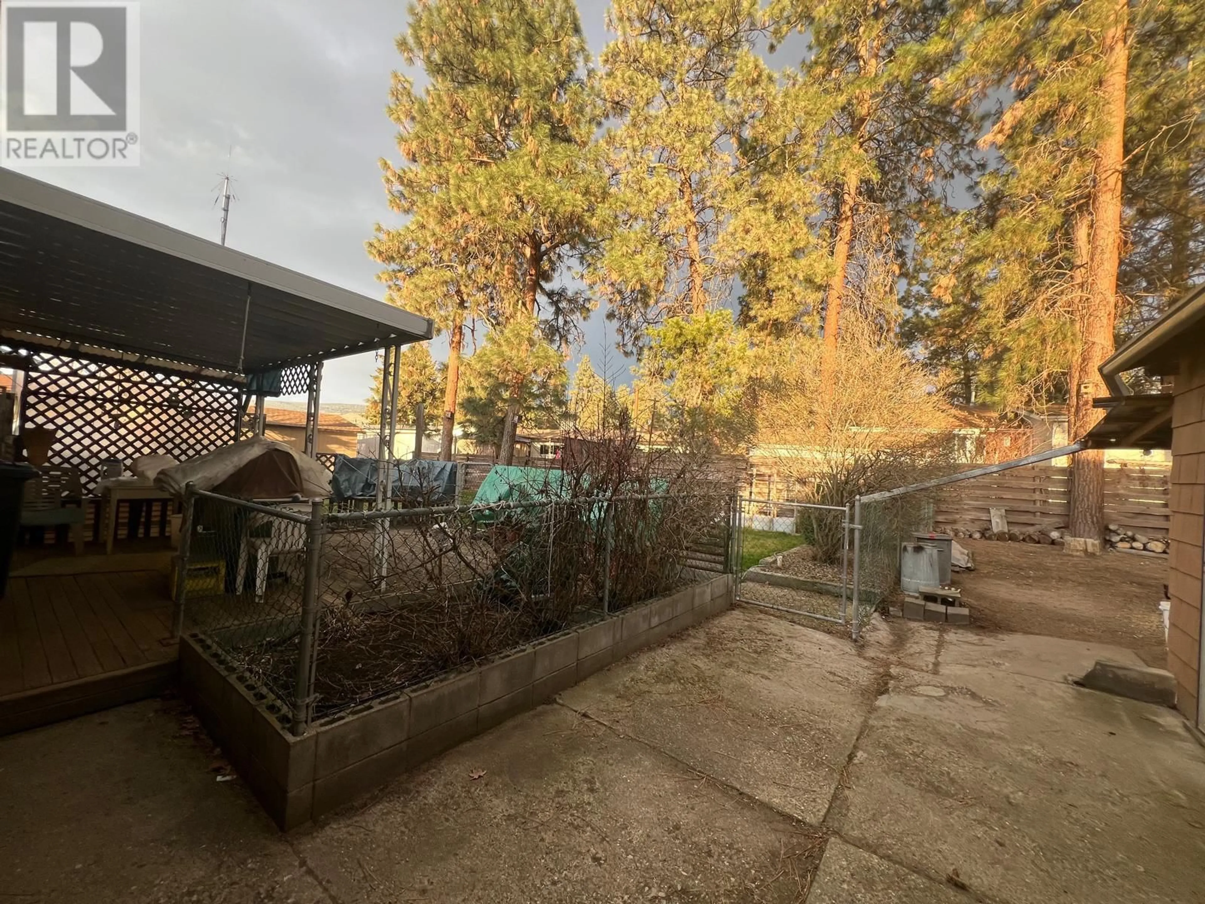 Patio, forest/trees view for 225 CAMBIE ROAD, Kelowna British Columbia V1X3H9